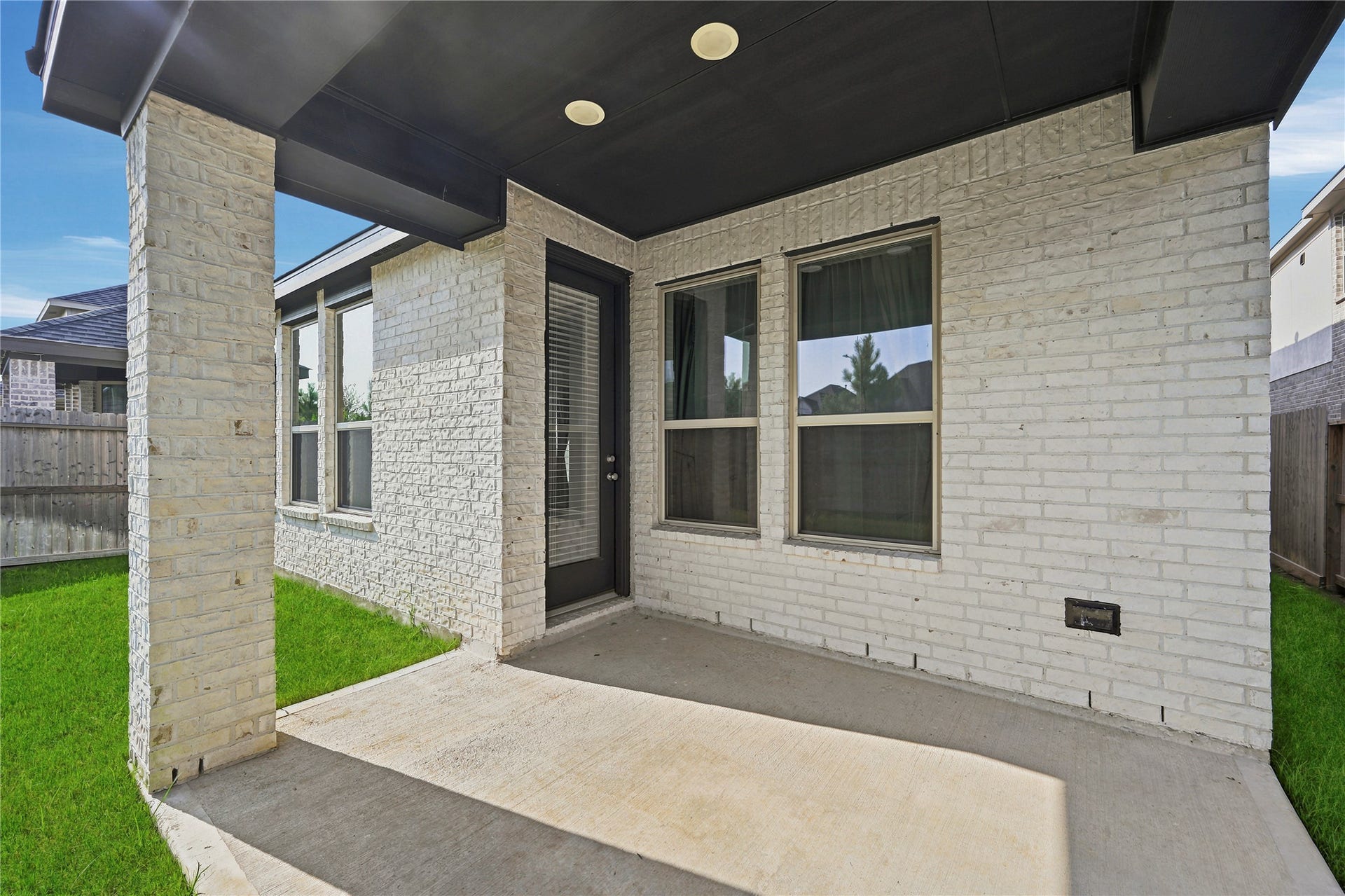 29821 Ellwood Lane, Fulshear, TX 77441 Covered back patio, perfect for outdoor dining, relaxing, or entertaining.