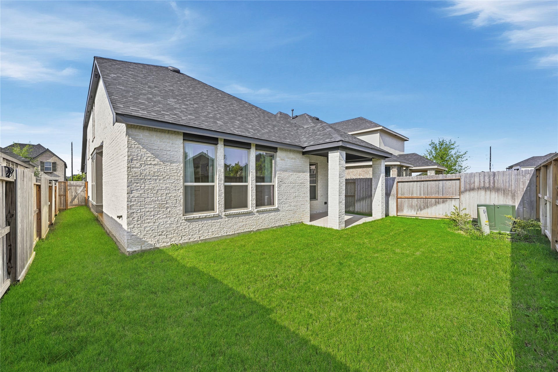 29821 Ellwood Lane, Fulshear, TX 77441 Backyard includes gated side access for added convenience.