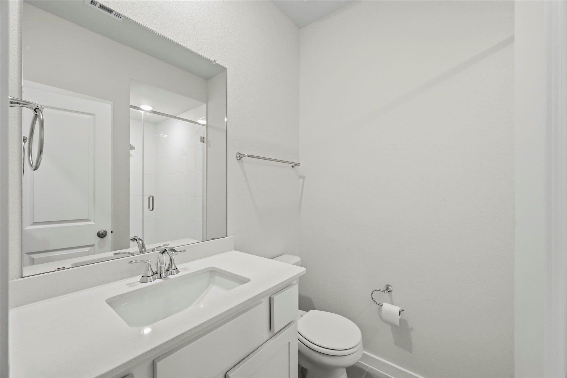 29821 Ellwood Lane, Fulshear, TX 77441 Full first-floor bathroom with a modern vanity and glass-enclosed shower.