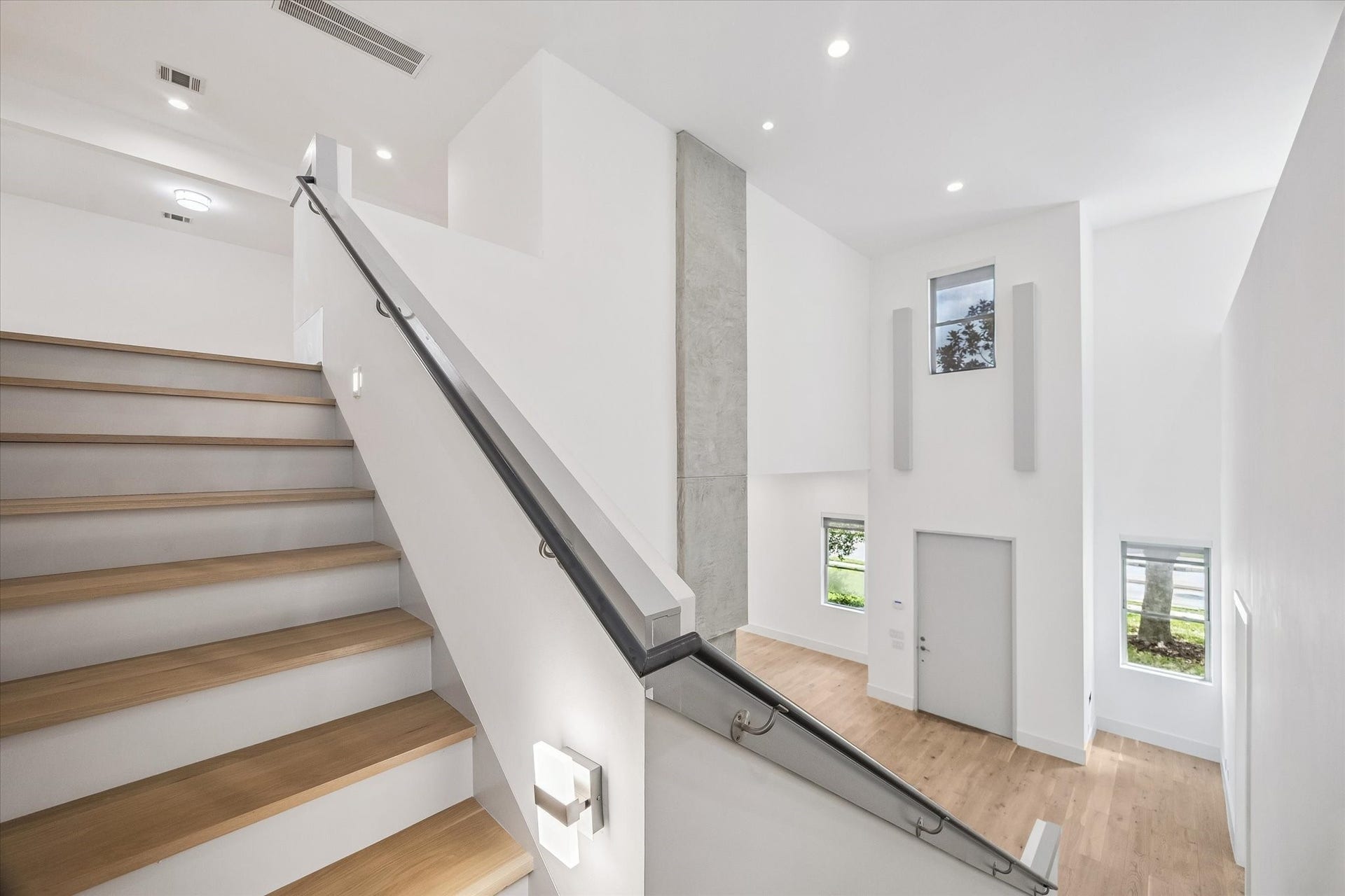 1601 Pine Chase Drive, Houston, TX 77055 Soaring ceilings, sculptural architectural details & illuminated stair treads highlight the homes custom design