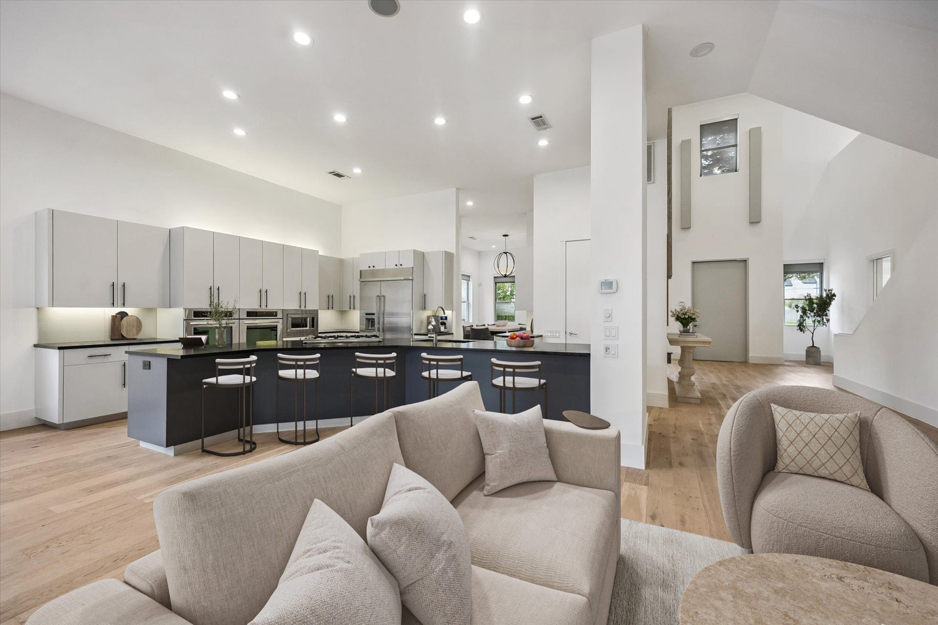 1601 Pine Chase Drive, Houston, TX 77055 At the heart of the kitchen, a substantial island with breakfast-bar seating creates an inviting hub for everyday living. Virtually staged