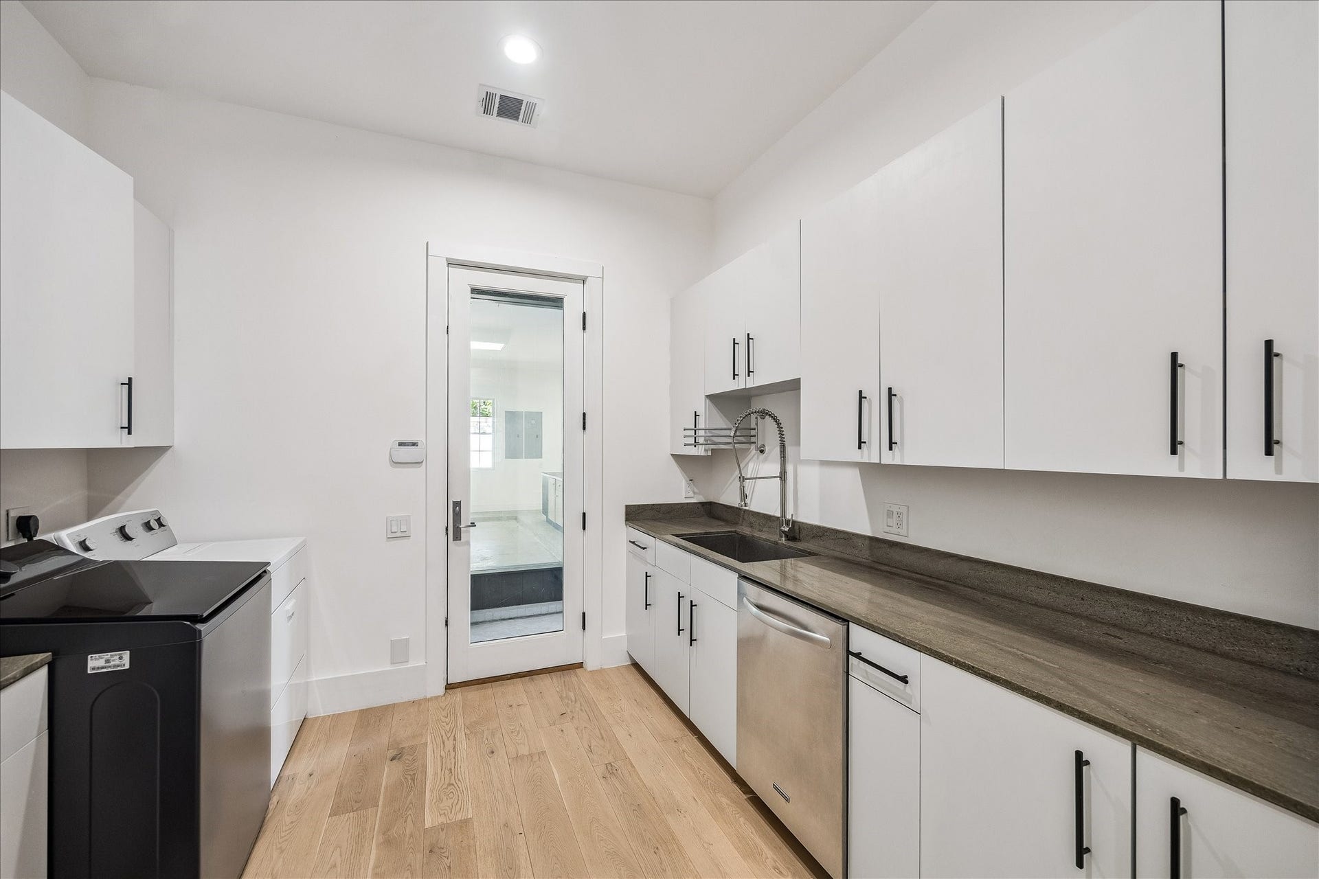 1601 Pine Chase Drive, Houston, TX 77055 Oversized utility room also offers prep kitchen convenience, located off the garage w/ a deep workstation sink, second refrigerator & second dishwasher