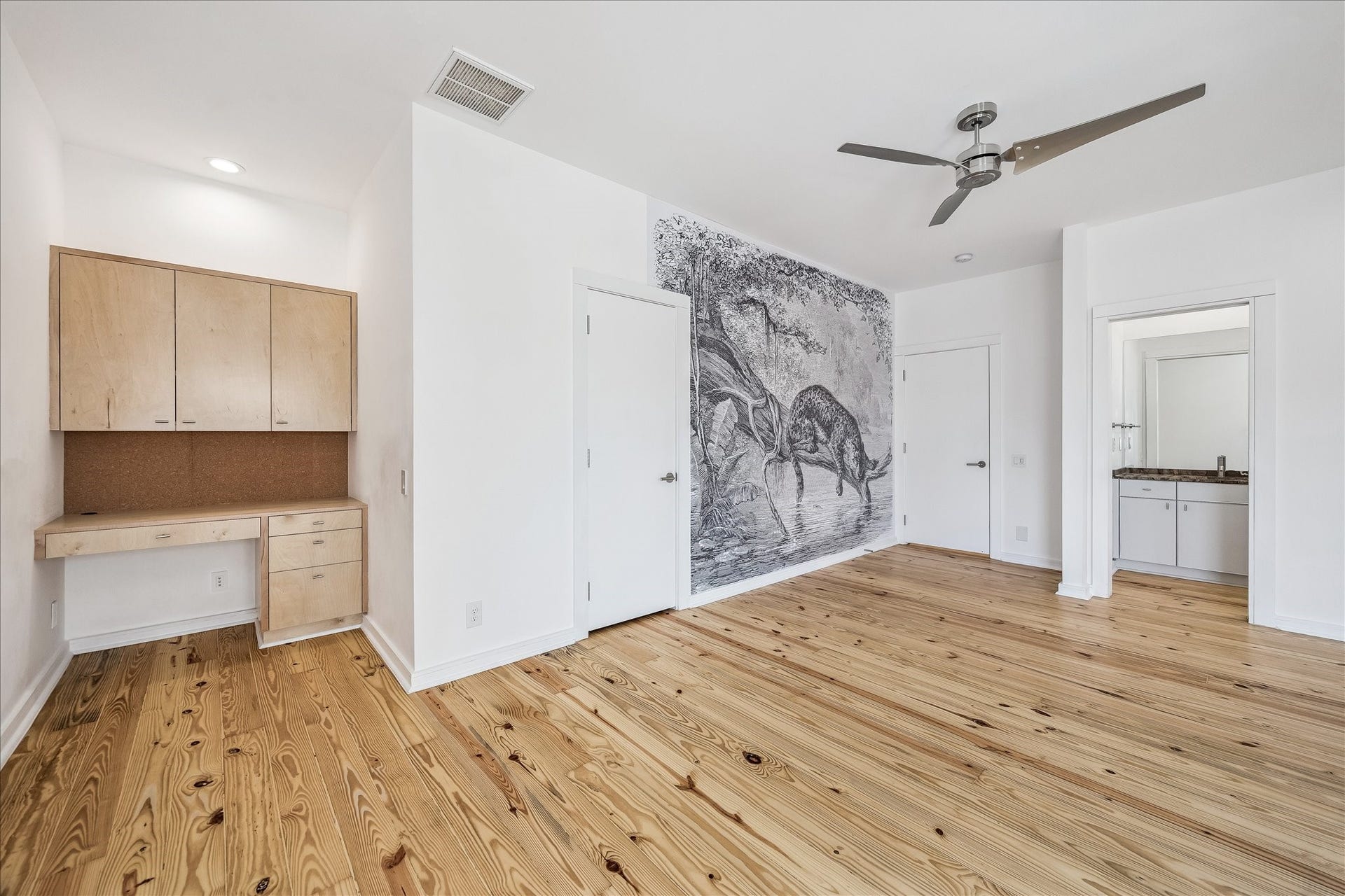 1601 Pine Chase Drive, Houston, TX 77055 Upstairs bedroom with built-in study desk and en-suite