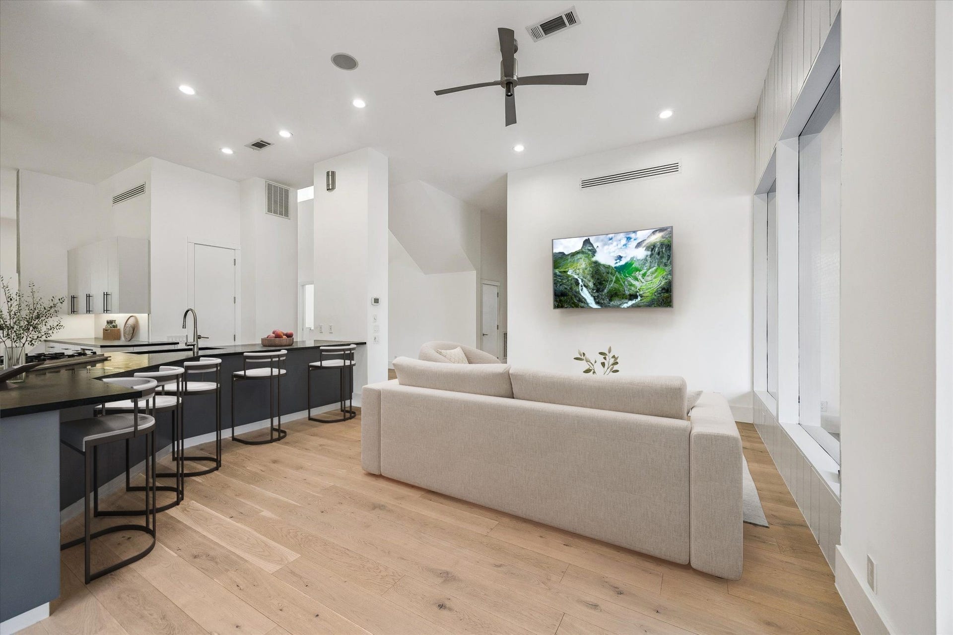 1601 Pine Chase Drive, Houston, TX 77055 Relaxed family room / TV Lounge. Note the sleek integrated linear air vents throughout. Virtually staged