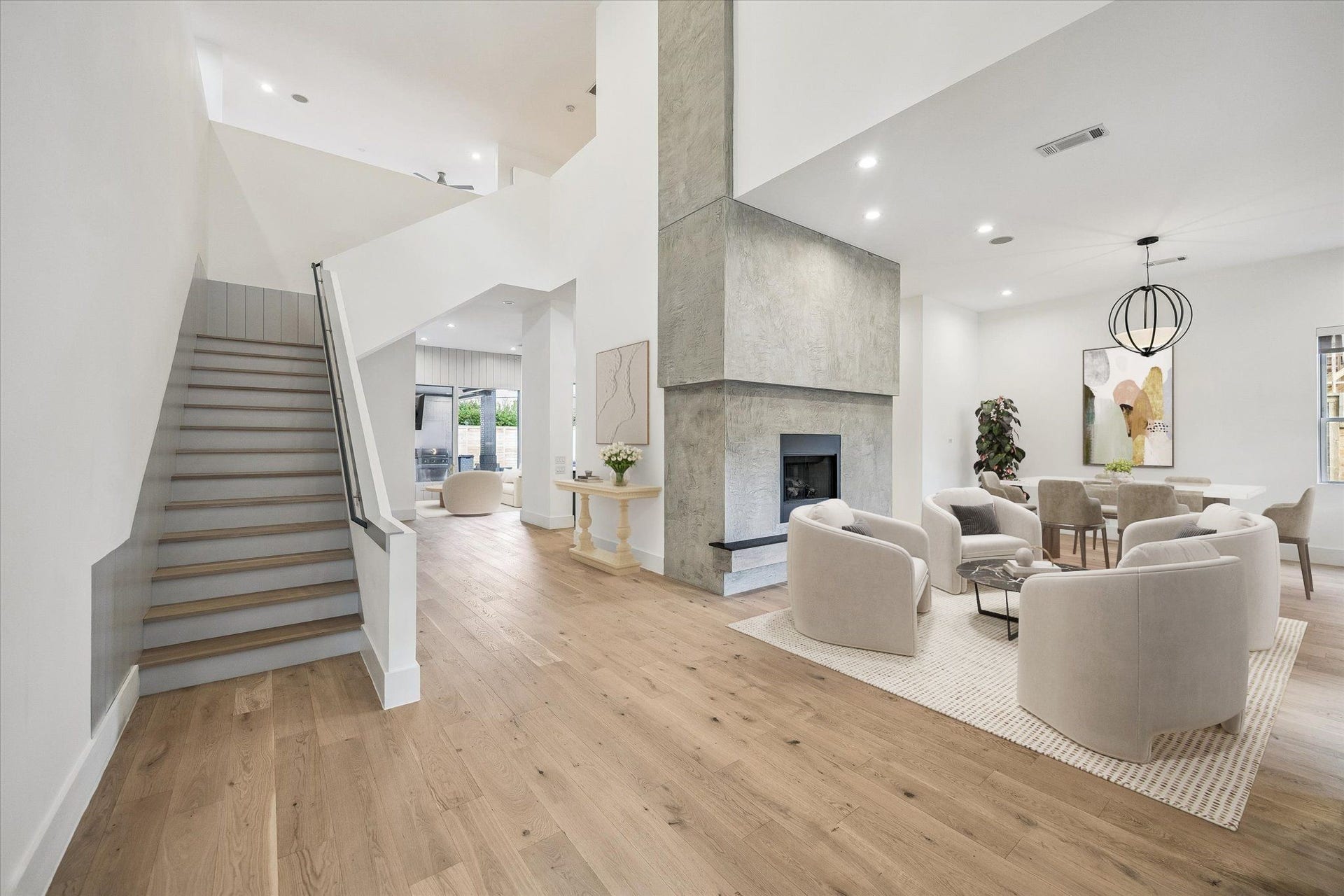 1601 Pine Chase Drive, Houston, TX 77055 Soaring 2-story foyer, striking architectural fireplace make a grand first impression. Hardwood floors throughout the home - no carpet in sight. Virtually staged