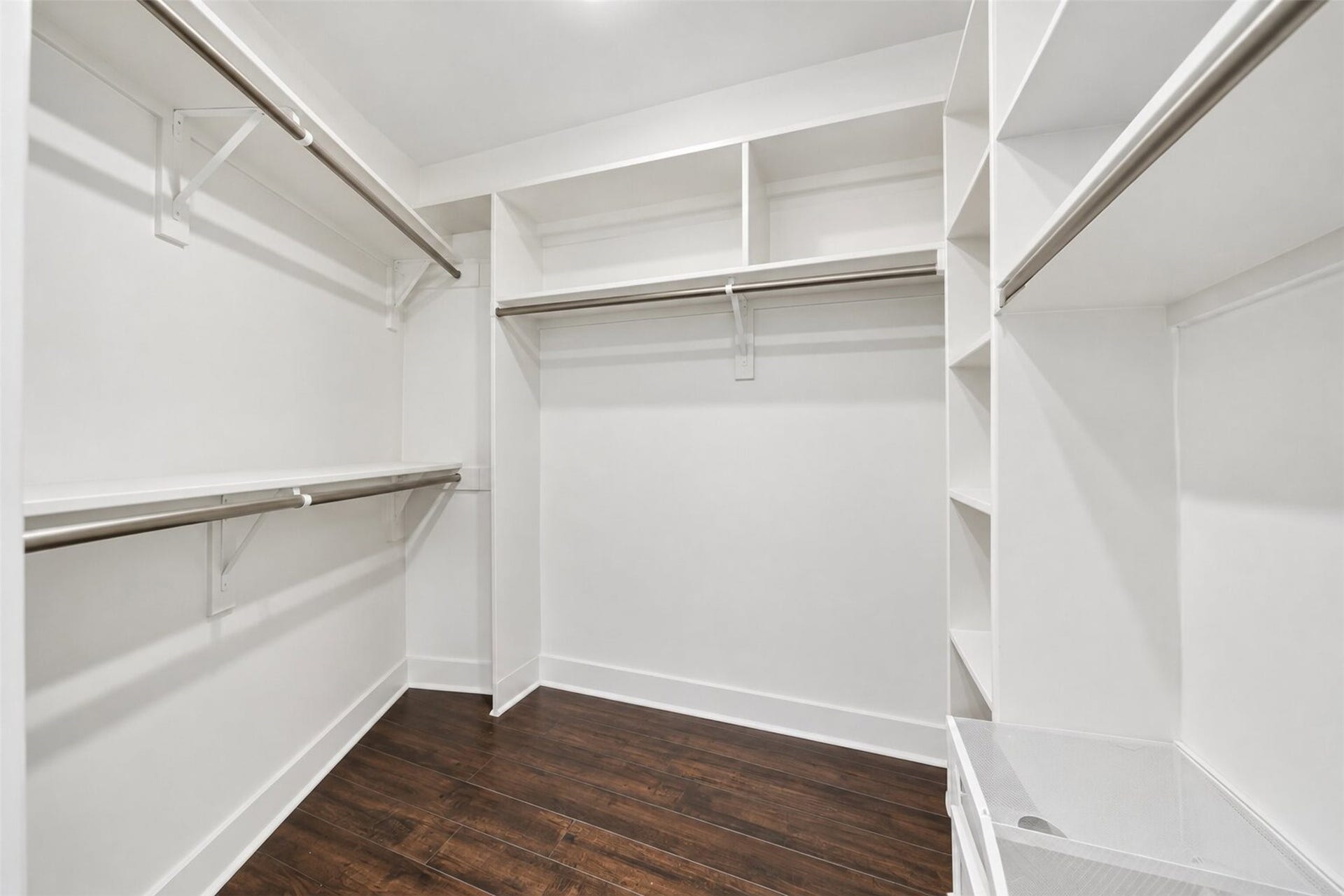 10818 Creektree Drive, Houston, TX 77070 Walk-In Closet
Spacious walk-in closet featuring custom-style built-in shelving, multiple hanging areas, and generous storage space for effortless organization.