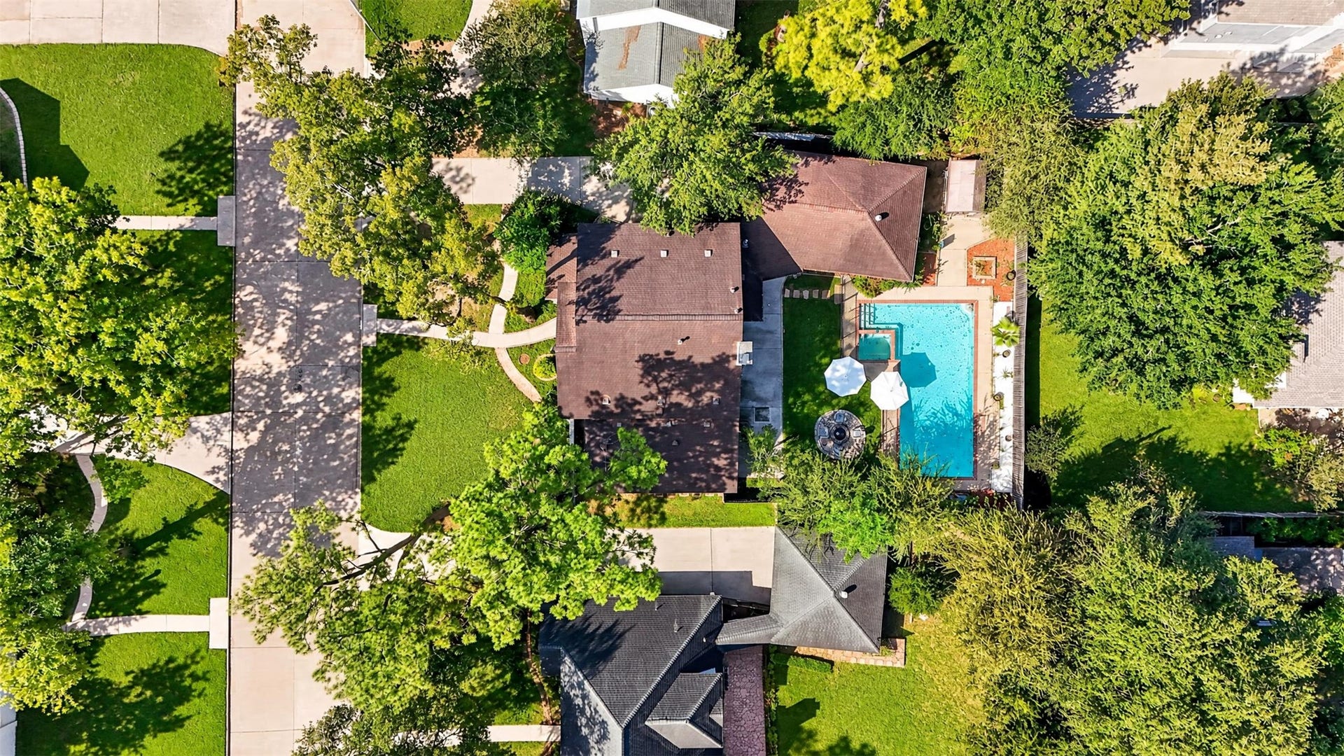 10818 Creektree Drive, Houston, TX 77070 Aerial Property View
Impressive aerial view showcasing the property's generous lot, mature landscaping, expansive backyard, and private swimming pool with adjoining spa.