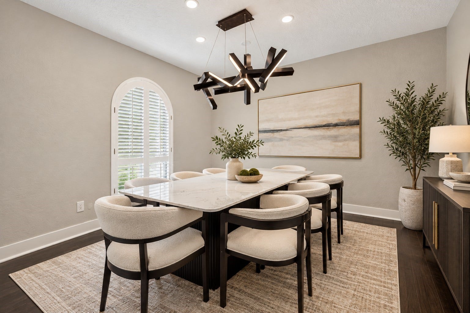 10818 Creektree Drive, Houston, TX 77070 Formal Dining Room (Virtually Staged)
Elegant formal dining room featuring beautiful wood flooring, a distinctive arched window with plantation shutters, and a statement chandelier. A sophisticated setting for hosting memorable gatherings.