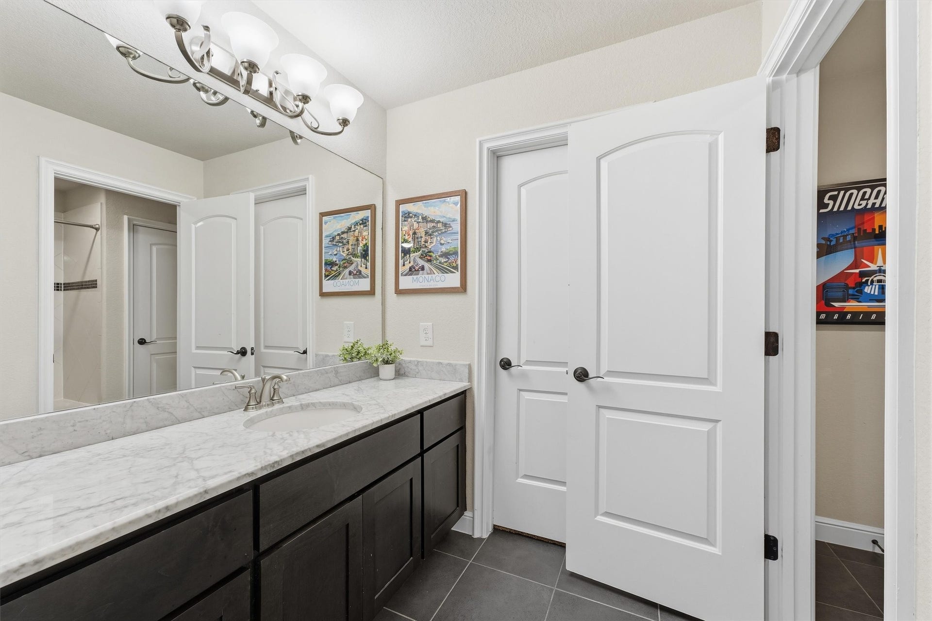 51 S Fremont Ridge Loop, Spring, TX 77389 Set apart from the other two upstairs bedrooms, this bedroom offers a private ensuite bath and walk-in closet.