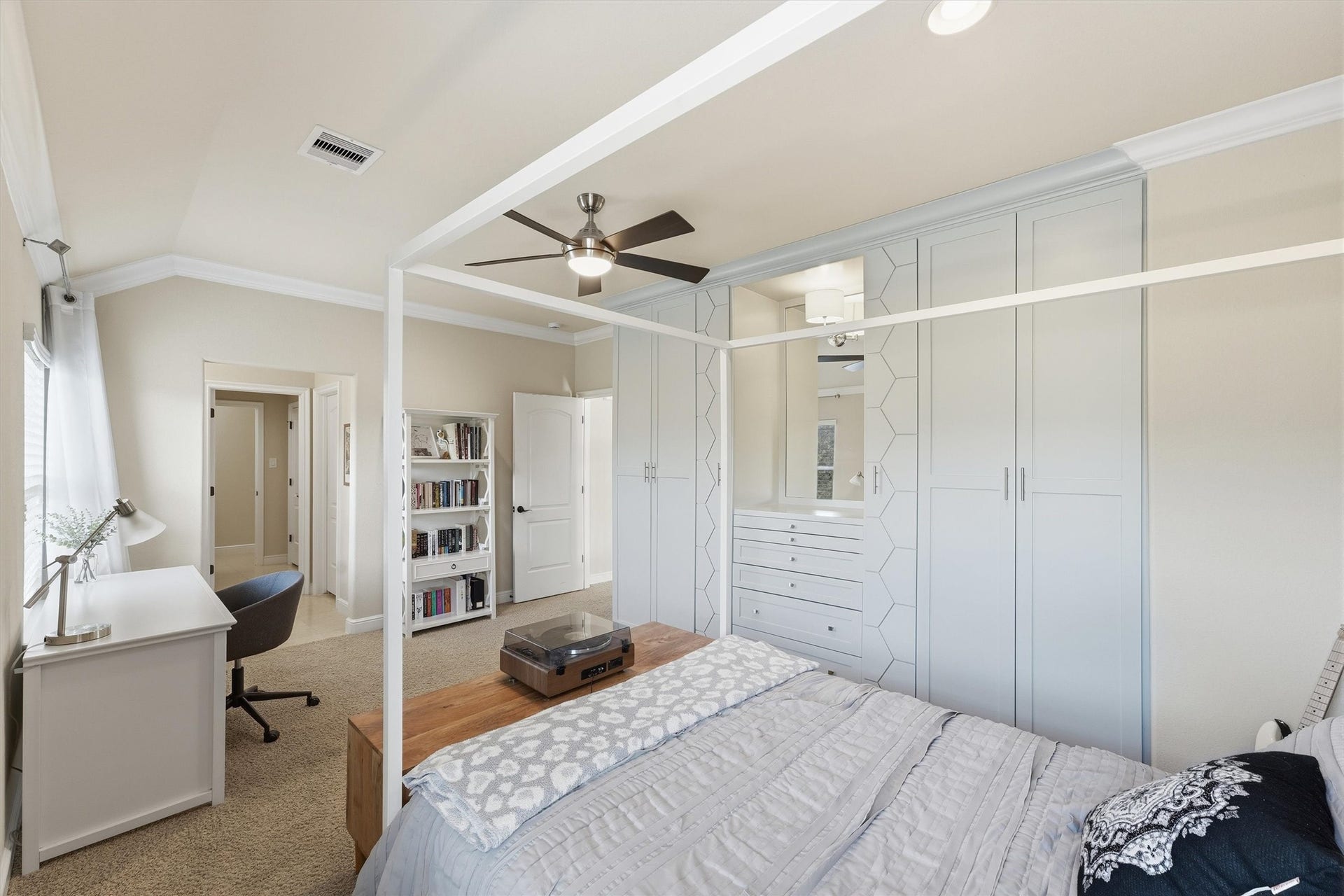51 S Fremont Ridge Loop, Spring, TX 77389 This bedroom also features custom built-ins with closet space, drawers, dedicated pullouts for handbags and jewelry, and a mirrored vanity for getting ready.