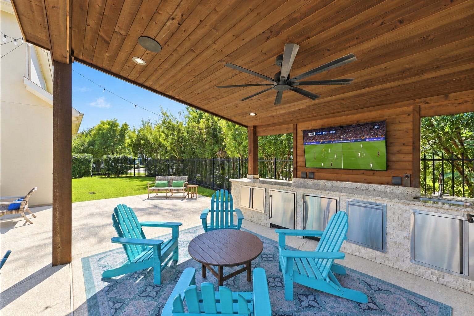 51 S Fremont Ridge Loop, Spring, TX 77389 A tongue-and-groove cedar ceiling, built-in speakers, TV, and generous granite counter space create an inviting setting for outdoor entertaining.