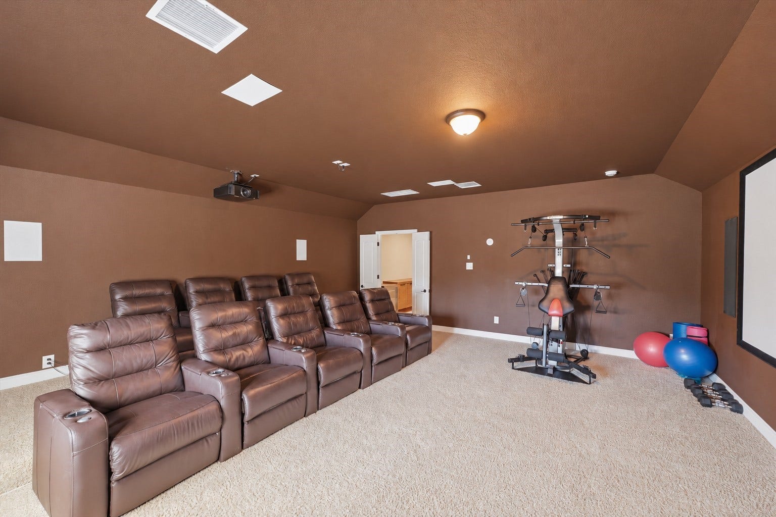 51 S Fremont Ridge Loop, Spring, TX 77389 The generously sized media room offers space for theater seating, exercise equipment, and even mattresses for sleepovers.
