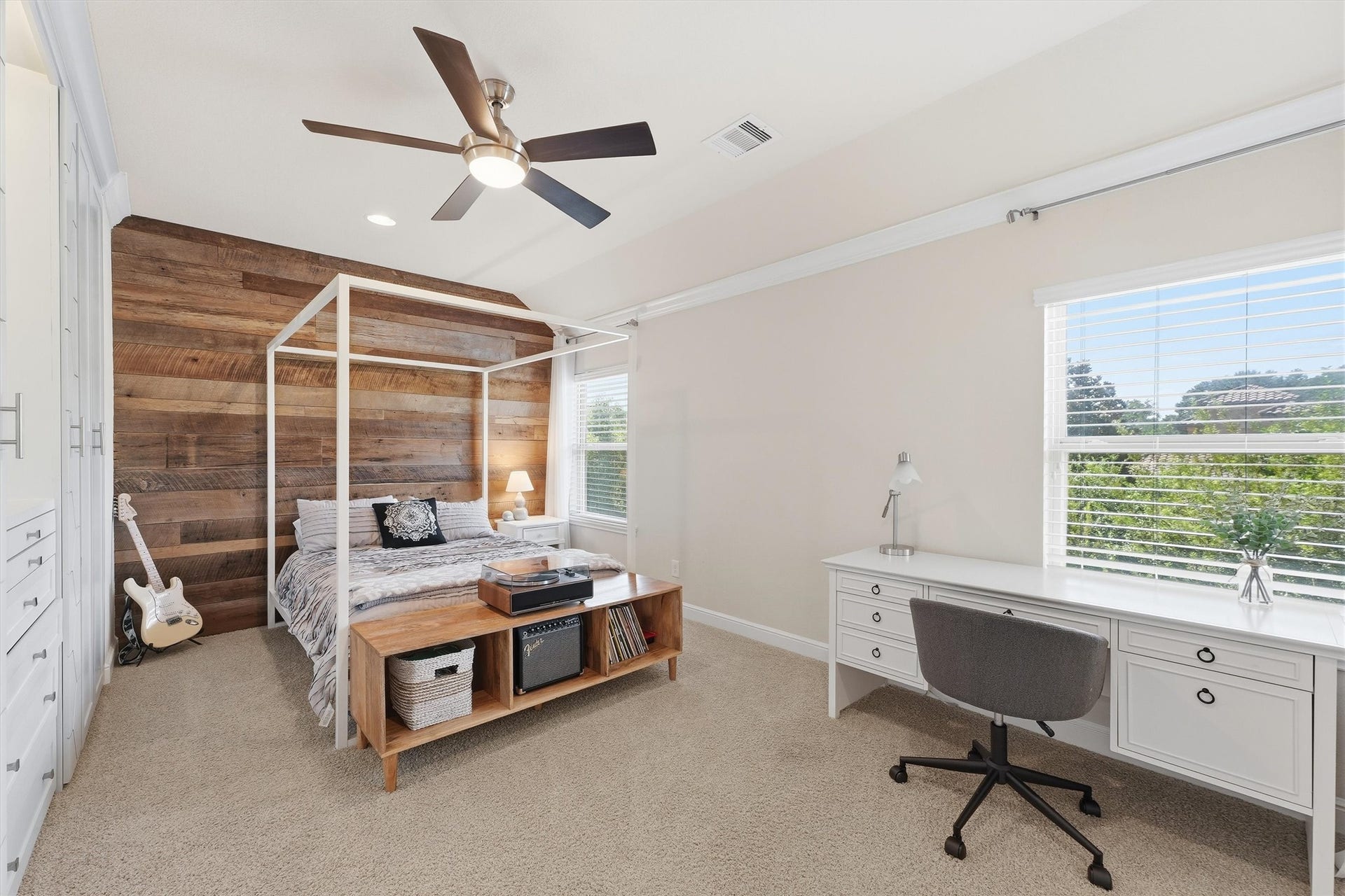 51 S Fremont Ridge Loop, Spring, TX 77389 A wood accent wall in this upstairs bedroom adds warmth and character, complemented by abundant natural light.