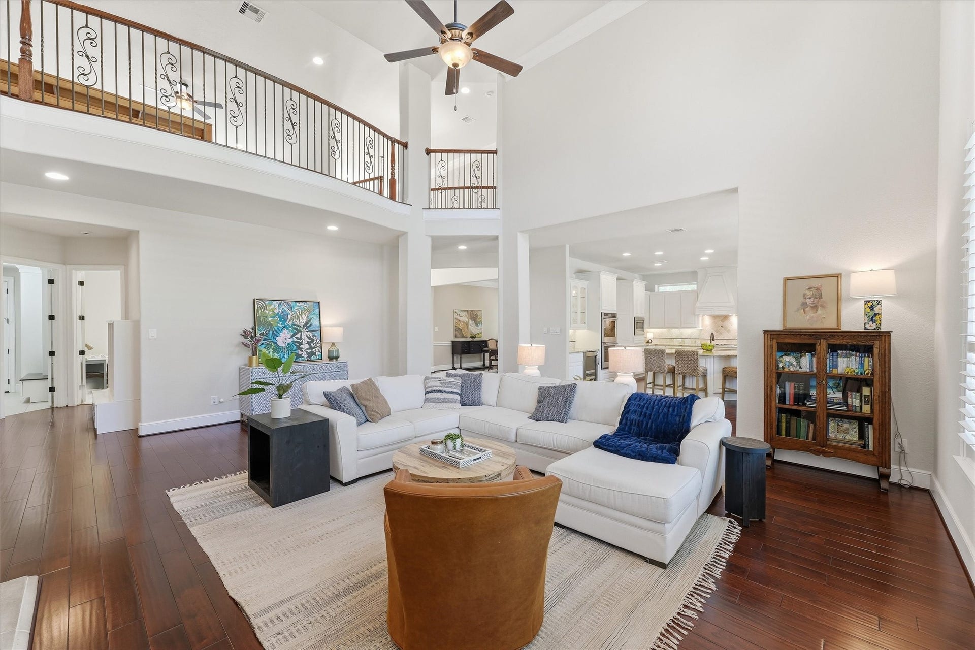 51 S Fremont Ridge Loop, Spring, TX 77389 The expansive family room offers an elegant setting for entertaining and everyday living, with the upstairs game room overlooking the space.