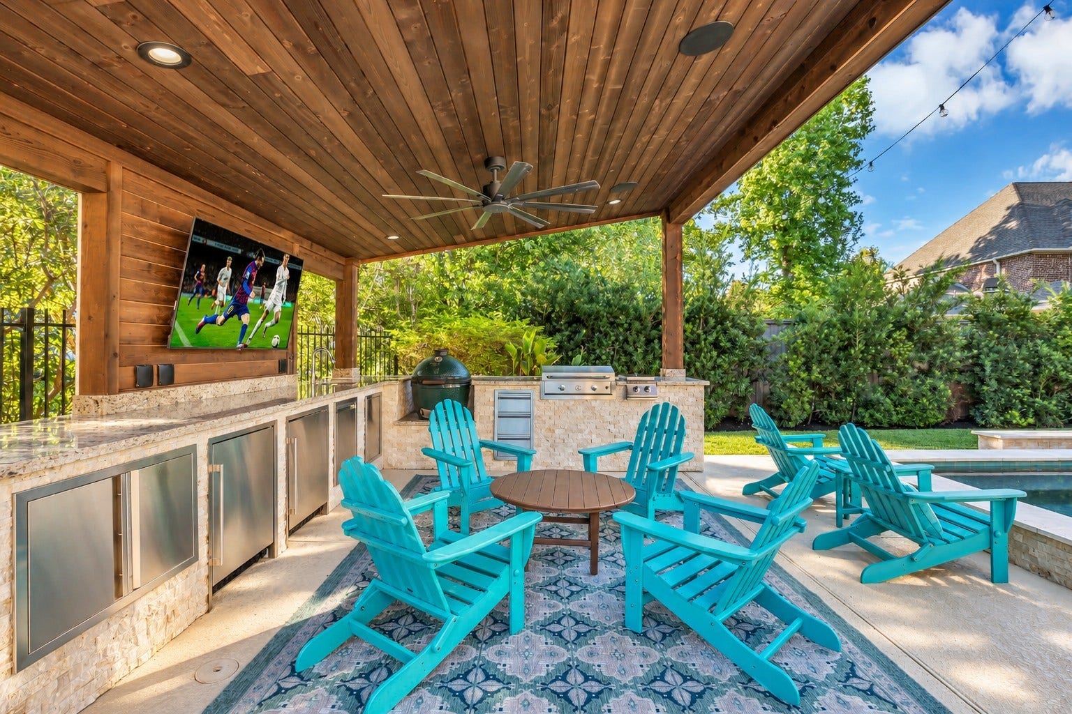 51 S Fremont Ridge Loop, Spring, TX 77389 The covered outdoor kitchen features two refrigerators, a grill, side burner, covered griddle, storage drawers, a trash pullout, and space for an XL Big Green Egg.