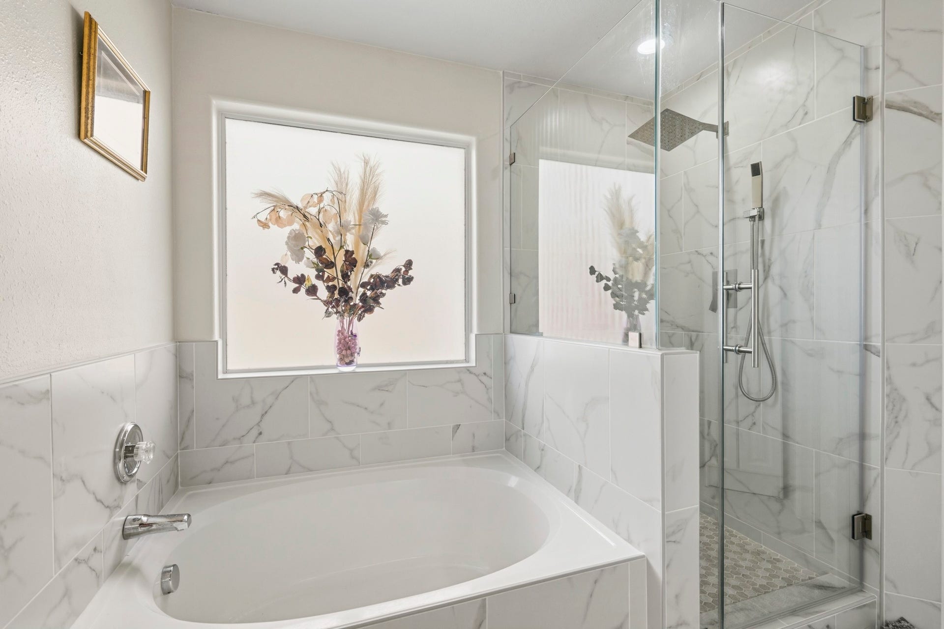 19302 Christine Crossing Drive, Richmond, TX 77407 Unwind in the remodeled primary bathroom, complete with a soaking tub and separate glass-enclosed shower.