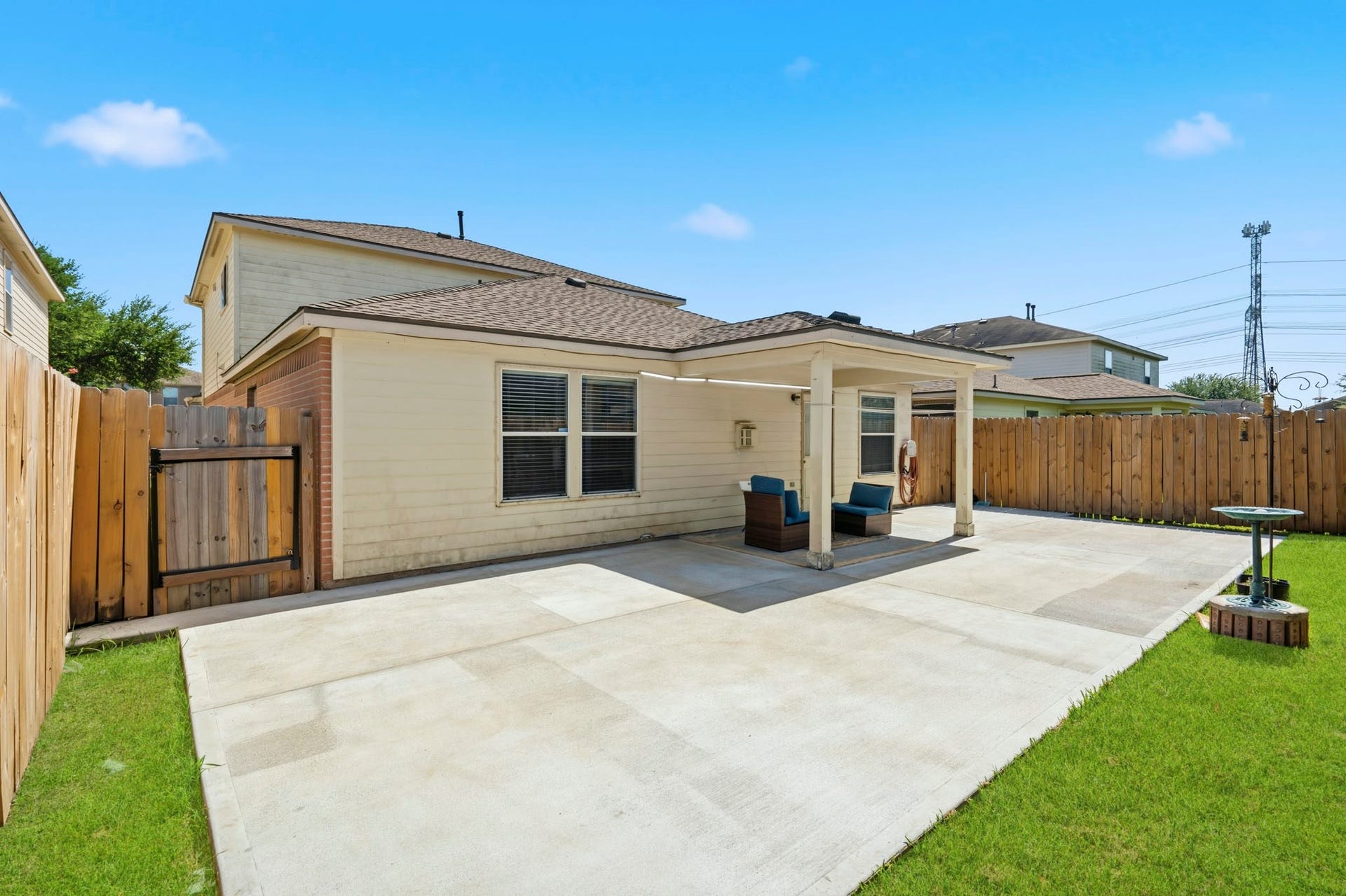 19302 Christine Crossing Drive, Richmond, TX 77407 The fenced backyard pairs a large patio with manageable lawn space, creating an easy setting for outdoor fun and relaxation.