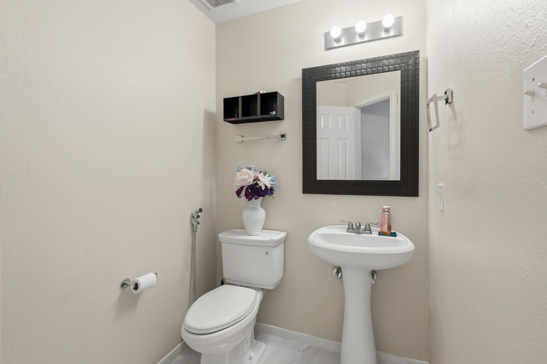 19302 Christine Crossing Drive, Richmond, TX 77407 A convenient half bath serves guests and the main living areas.