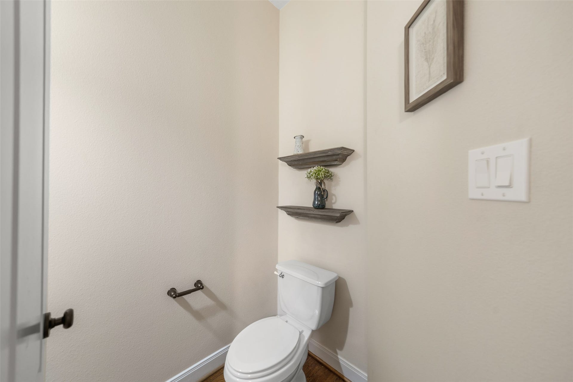 34 Danby Place, The Woodlands, TX 77375 This half bathroom offers a simple, functional and elegant space.