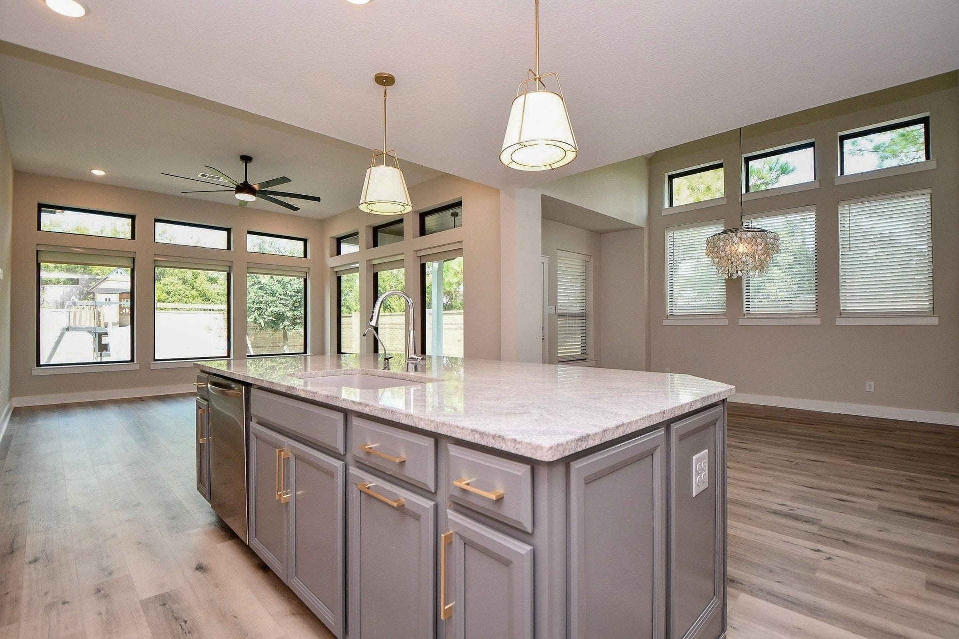 15239 Momentous Path, Cypress, TX 77433 Those windows let the light in, but not the heat! They have protective film on the outside keeping the heat out!