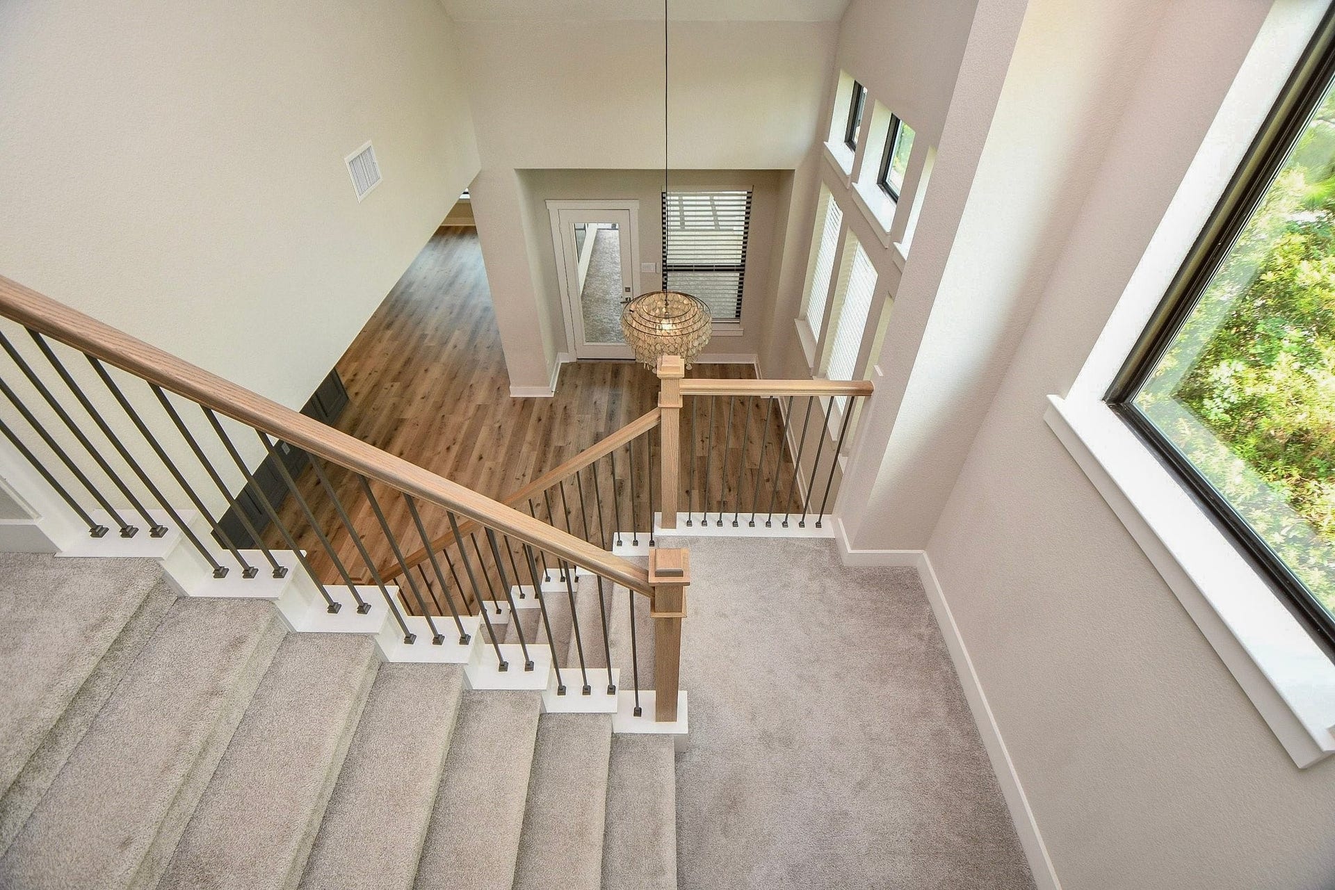 15239 Momentous Path, Cypress, TX 77433 A perspective looking down into the dining area from the game room.
