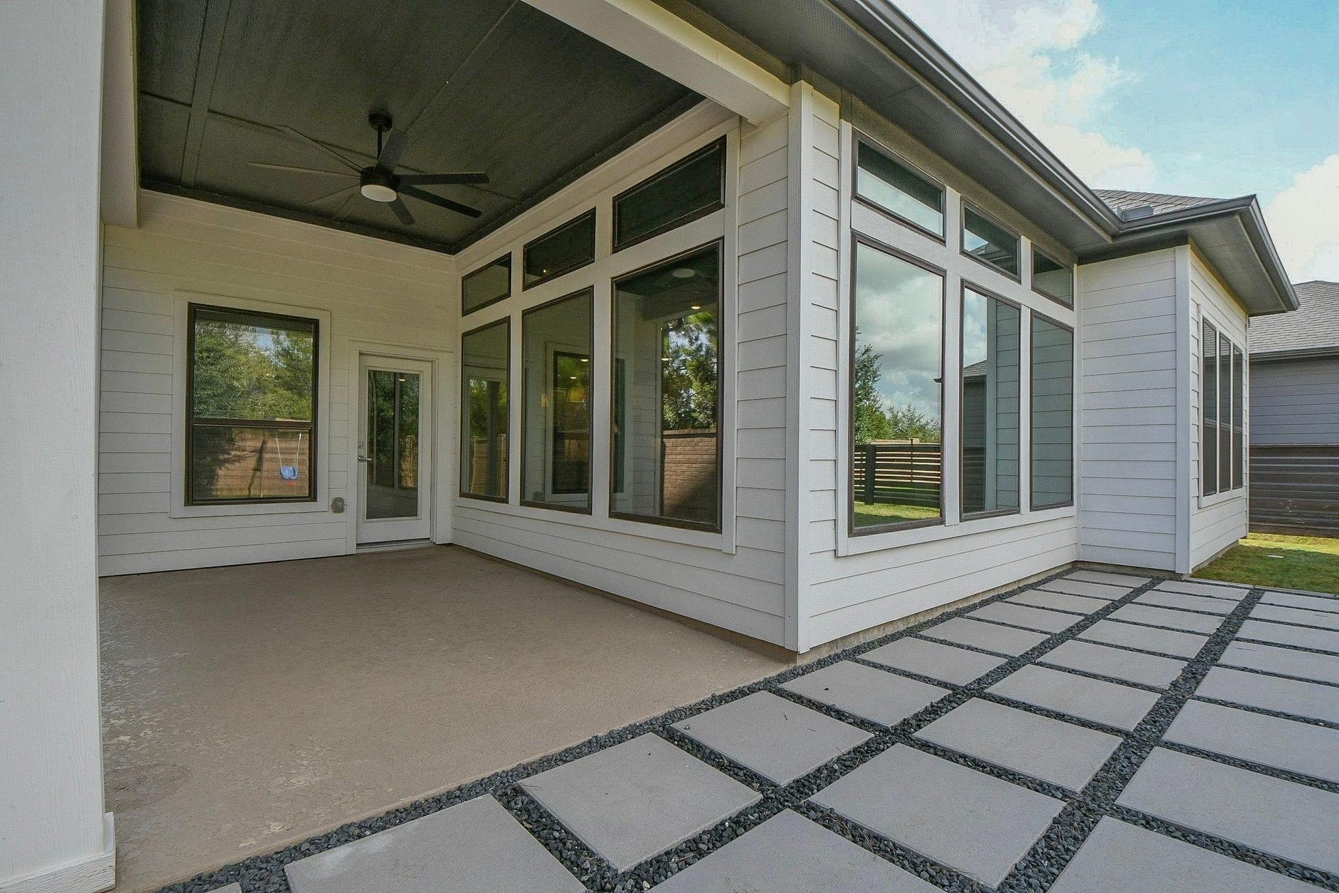 15239 Momentous Path, Cypress, TX 77433 The pavestone and rock add-on looks great, and offers a greater space for entertaining guests.