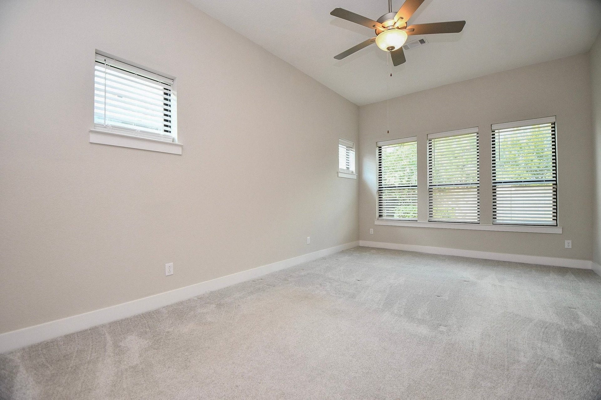 15239 Momentous Path, Cypress, TX 77433 The primary suite has not shortage of windows, letting all the natural light in! Alternatively, you can close the blinds.