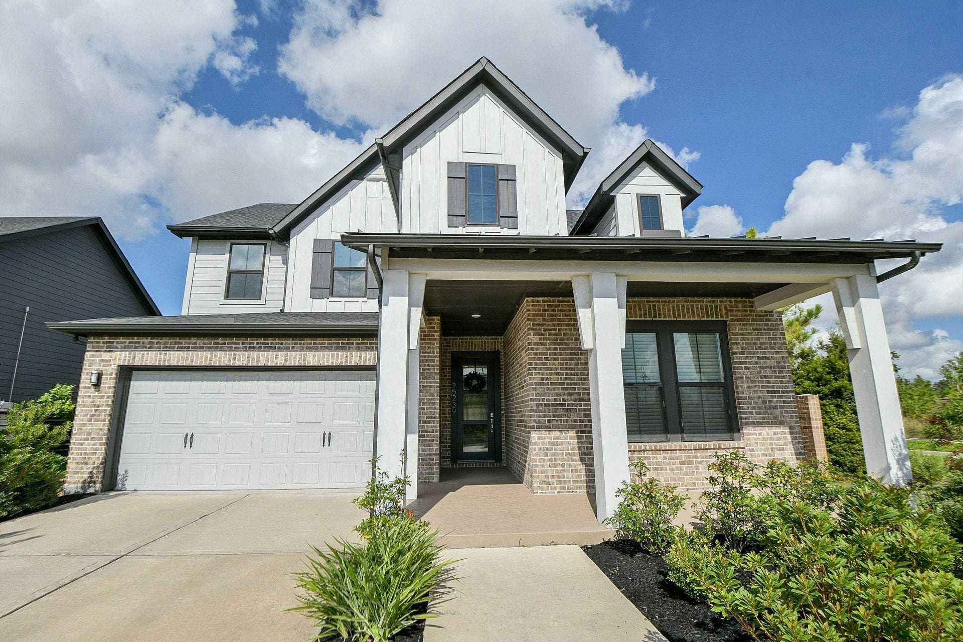 15239 Momentous Path, Cypress, TX 77433 Double wide driveway provides easy access for both vehicles into the garage.
