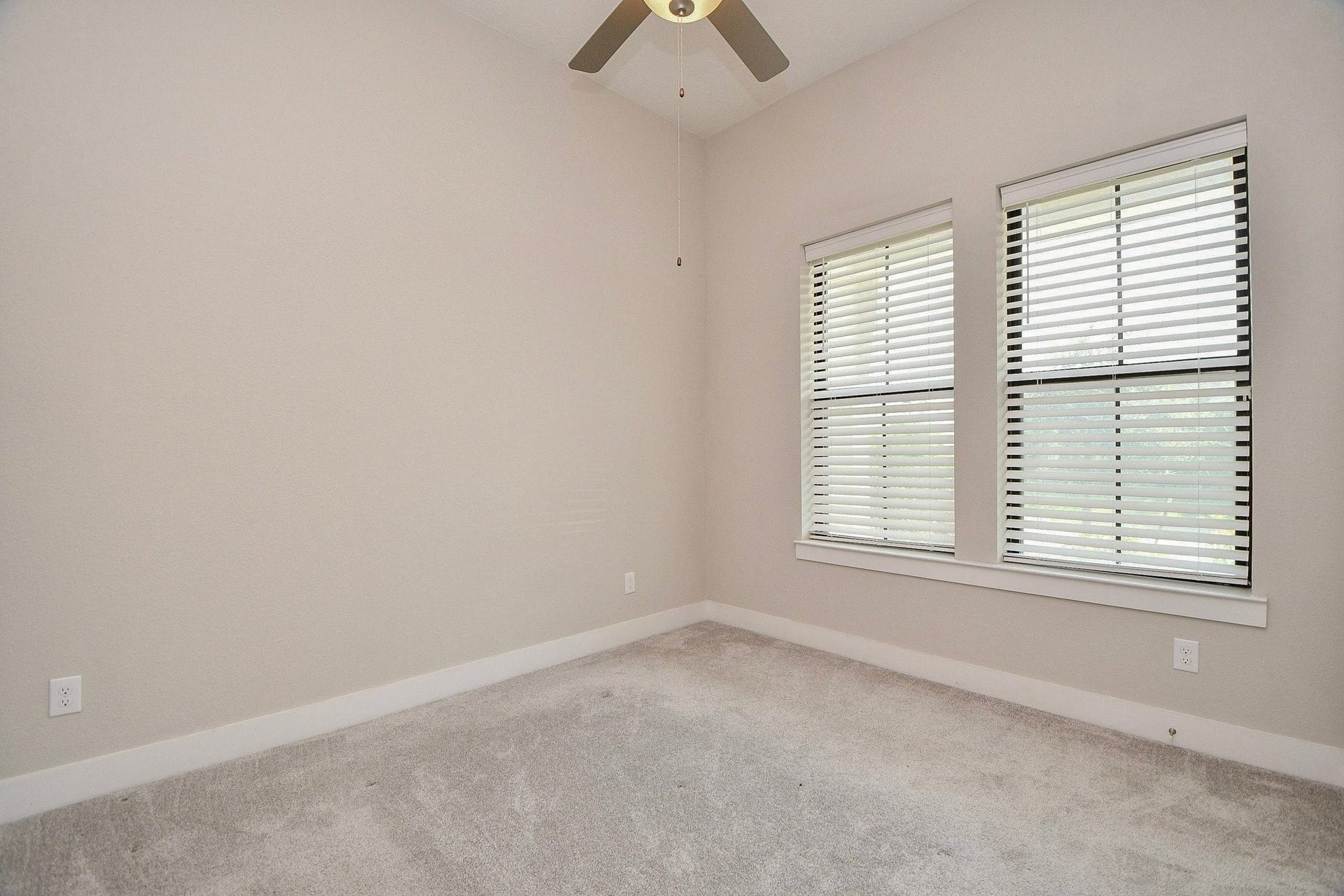 15239 Momentous Path, Cypress, TX 77433 Before you look further to the upstairs space, we still have another bedroom to show you! At the front of the house, this guest bedroom comes with a little privacy.