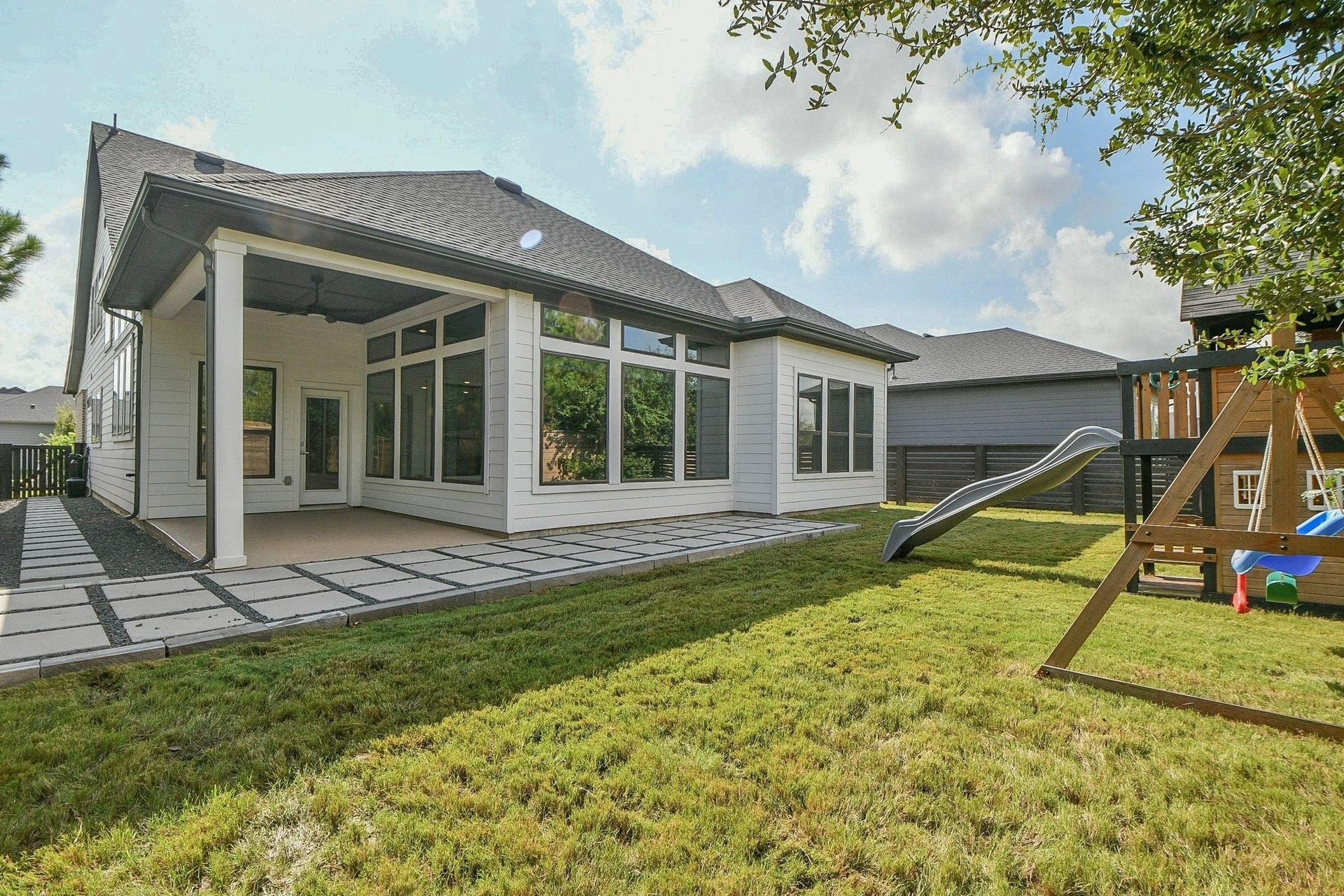 15239 Momentous Path, Cypress, TX 77433 The back yard is still large outside the wrap around custom designed patio out back.