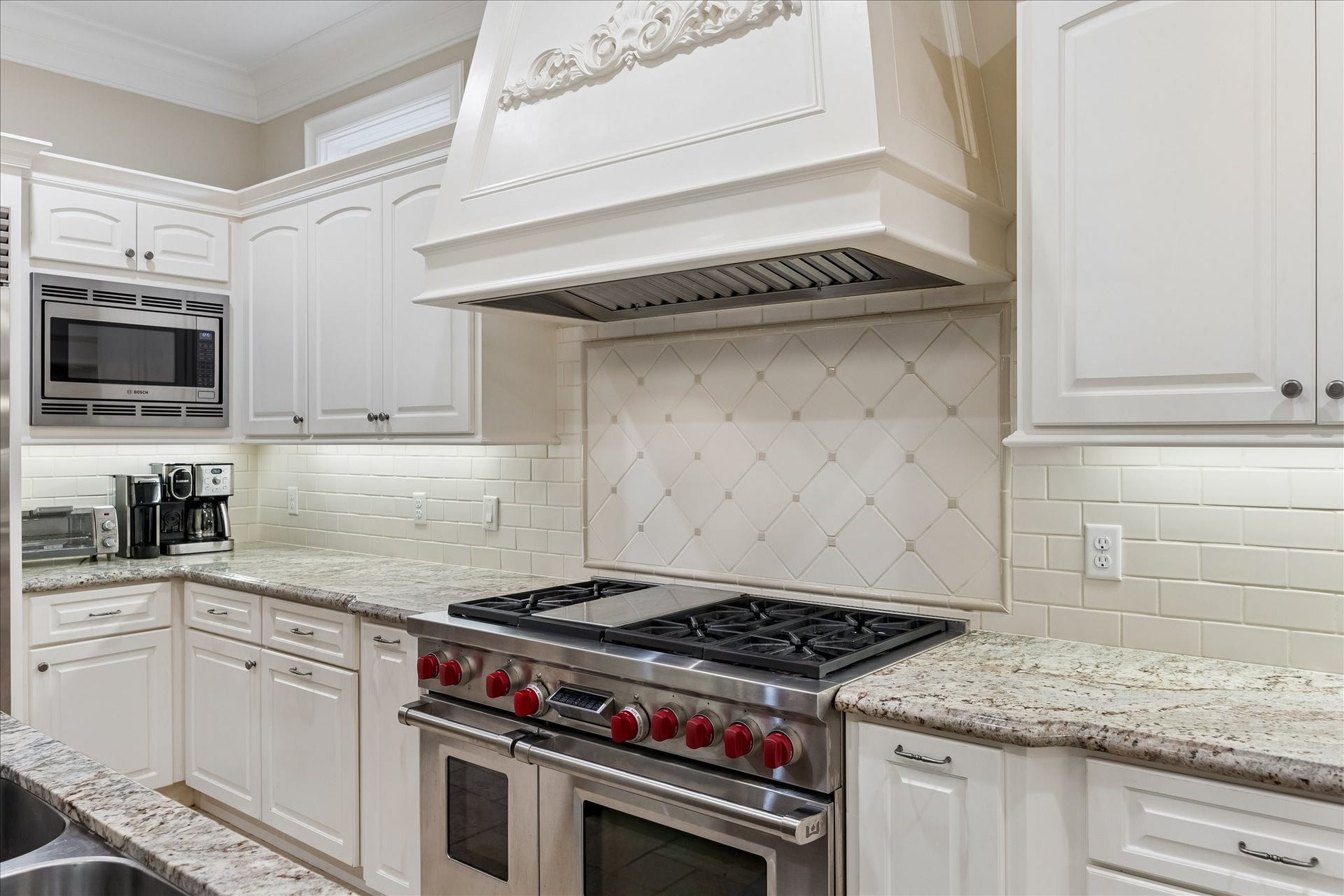 6-burner gas Wolf Range with double ovens and griddle.