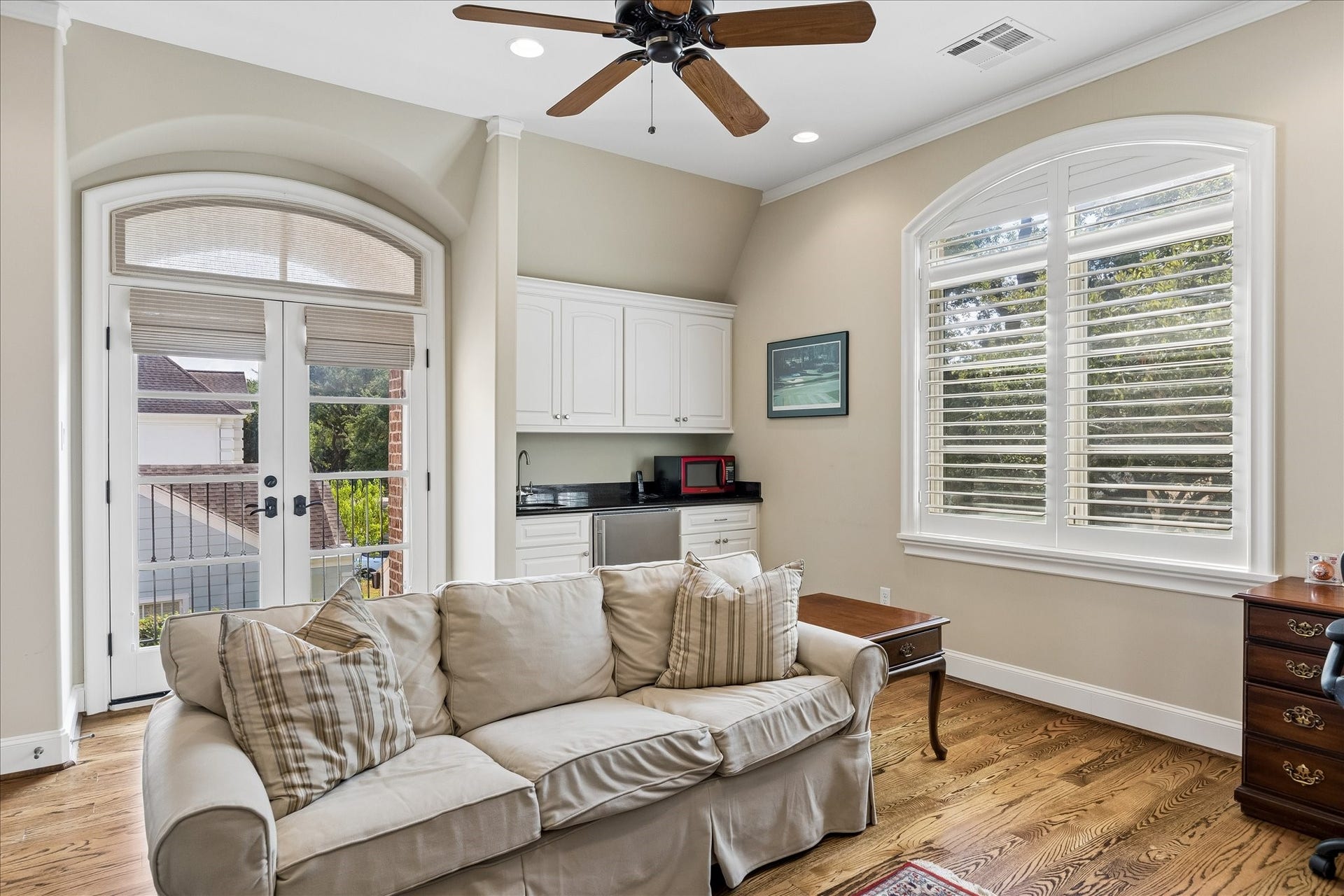 Fourth bedroom with wet bar set up for game room capabilities. French door access to Juliet balcony.