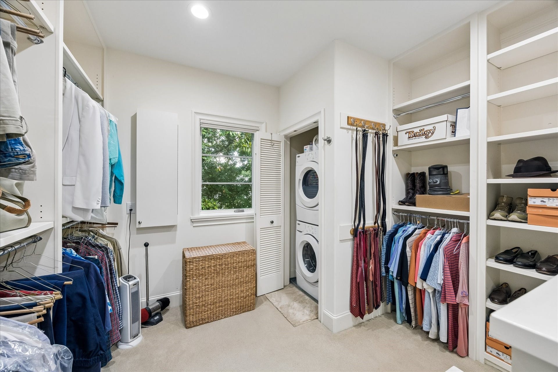 Conveniently located in the primary closet, a stackable washer/dryer is a secondary option to the full laundry room located on the first floor.