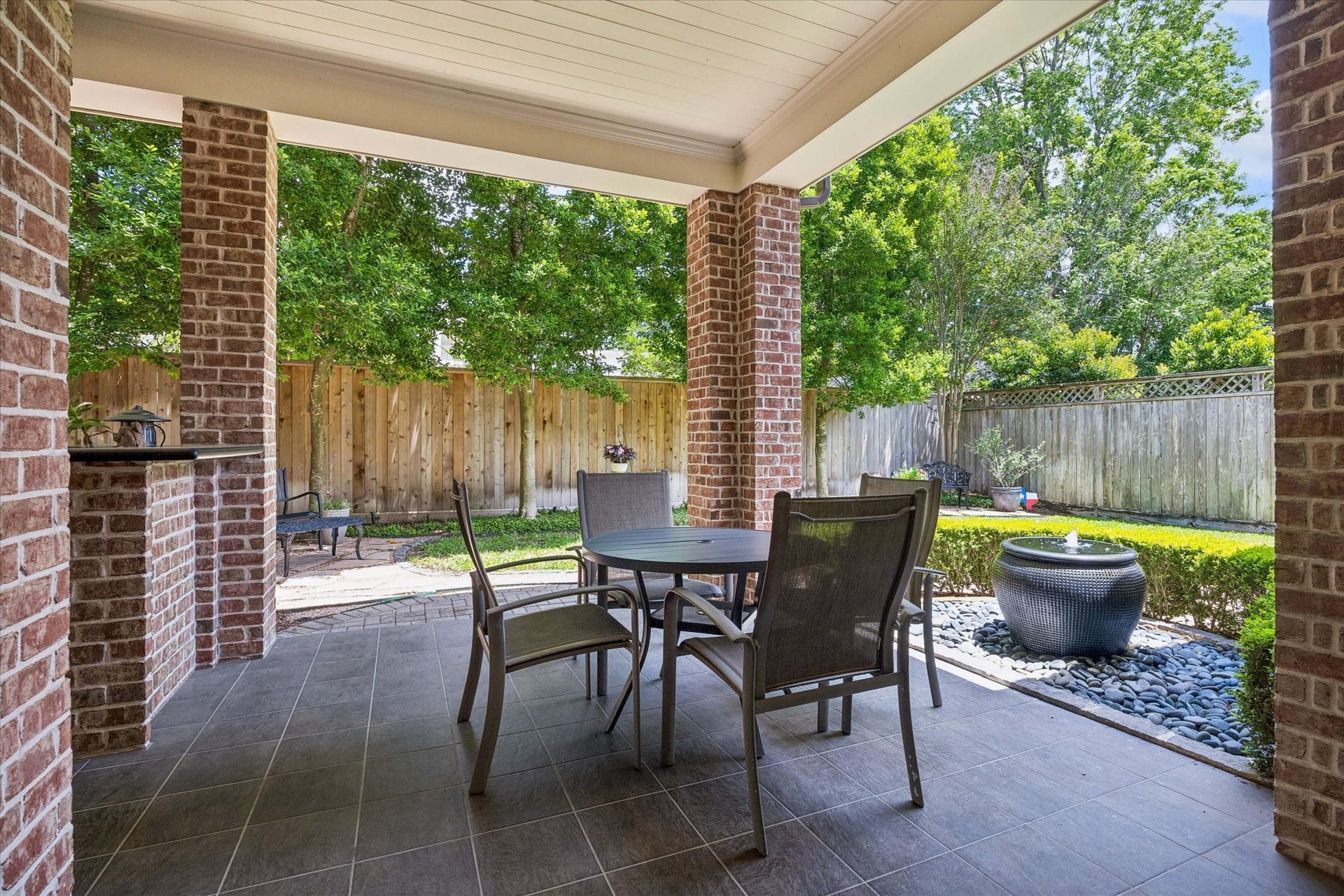 Covered dining area adjacent to the outside kitchen.