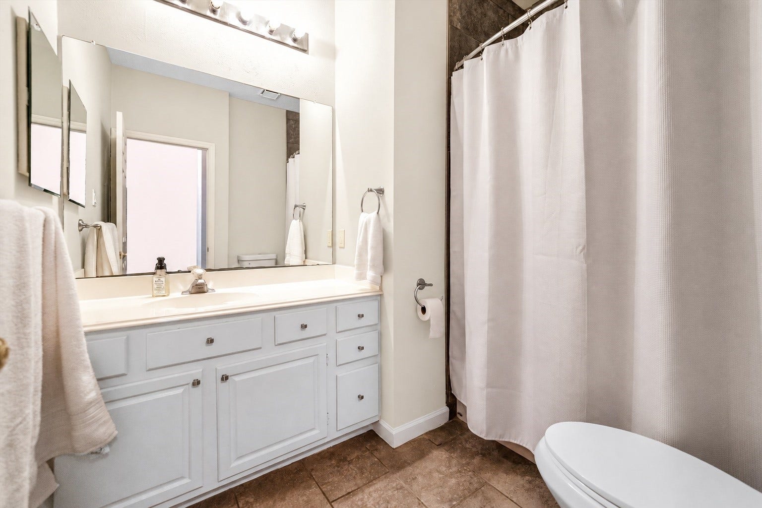 11 Sweetdream Place, The Woodlands, TX 77381 Bright and inviting bathroom with a large vanity, ample storage, and a clean shower area.