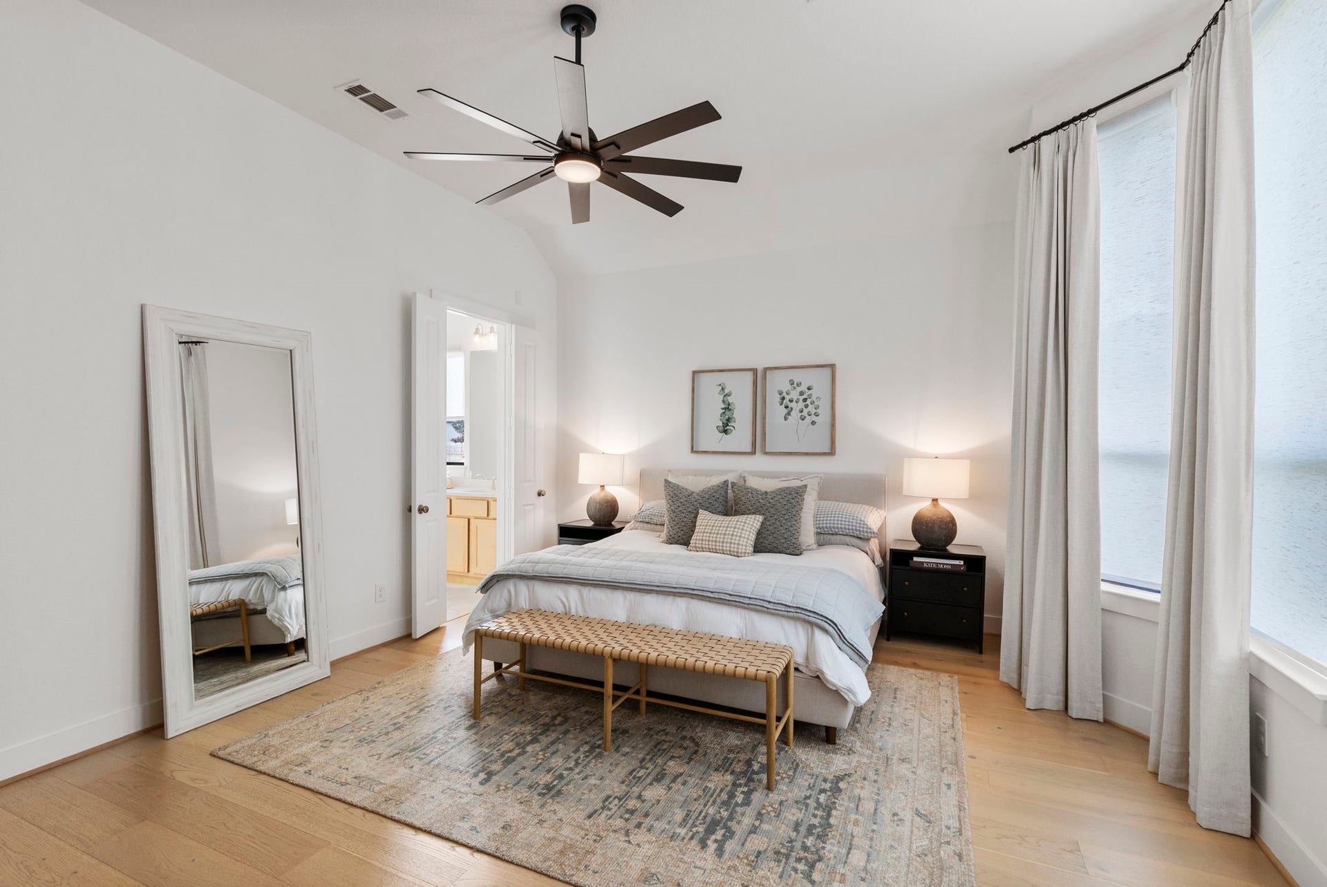 18030 Blu Terrace Drive, Conroe, TX 77302 Bright bedroom with soaring ceilings, wide-plank hardwood floors, and oversized windows for abundant natural light.