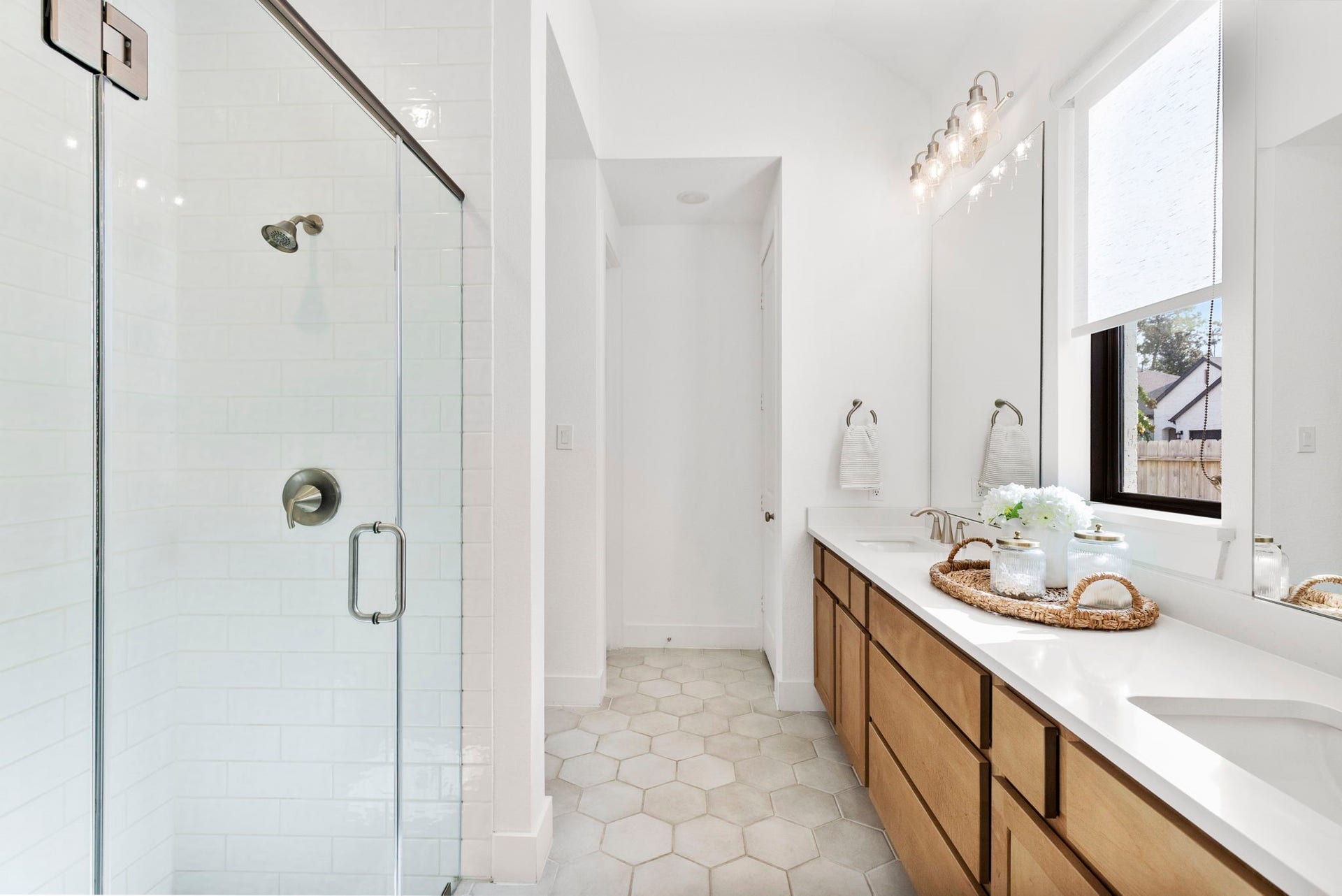 18030 Blu Terrace Drive, Conroe, TX 77302 Spa-like bath with oversized vanity, and bright window for natural light.