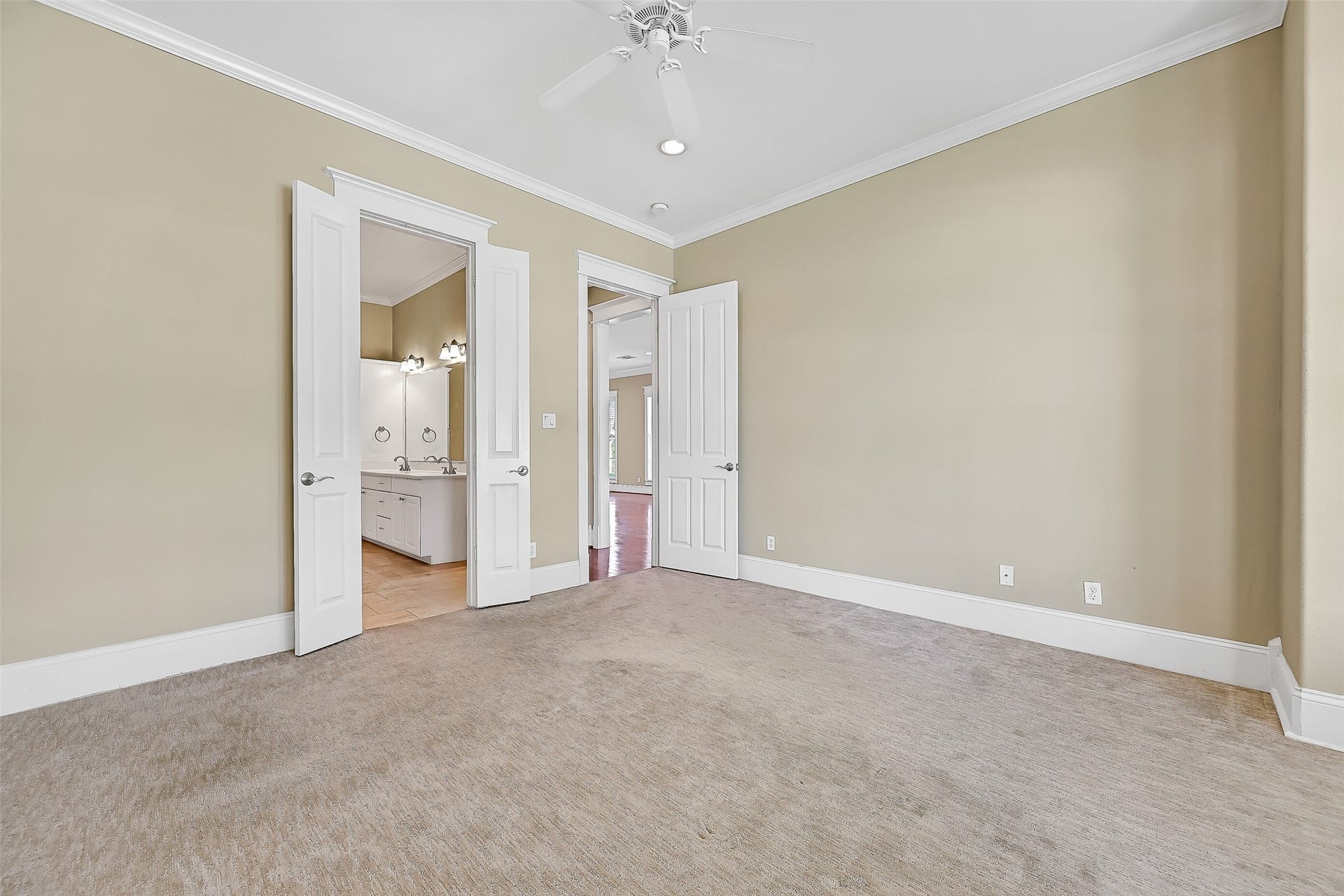 6 Barque Lane, Galveston, TX 77554 Primary bath access is had by the double doors to the left.