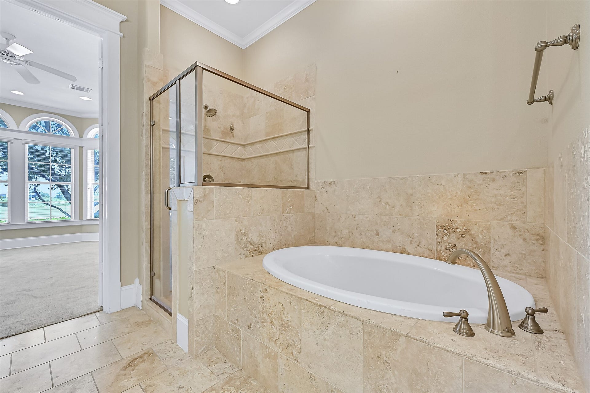 6 Barque Lane, Galveston, TX 77554 Glass-framed walk-in shower and soaking tub.