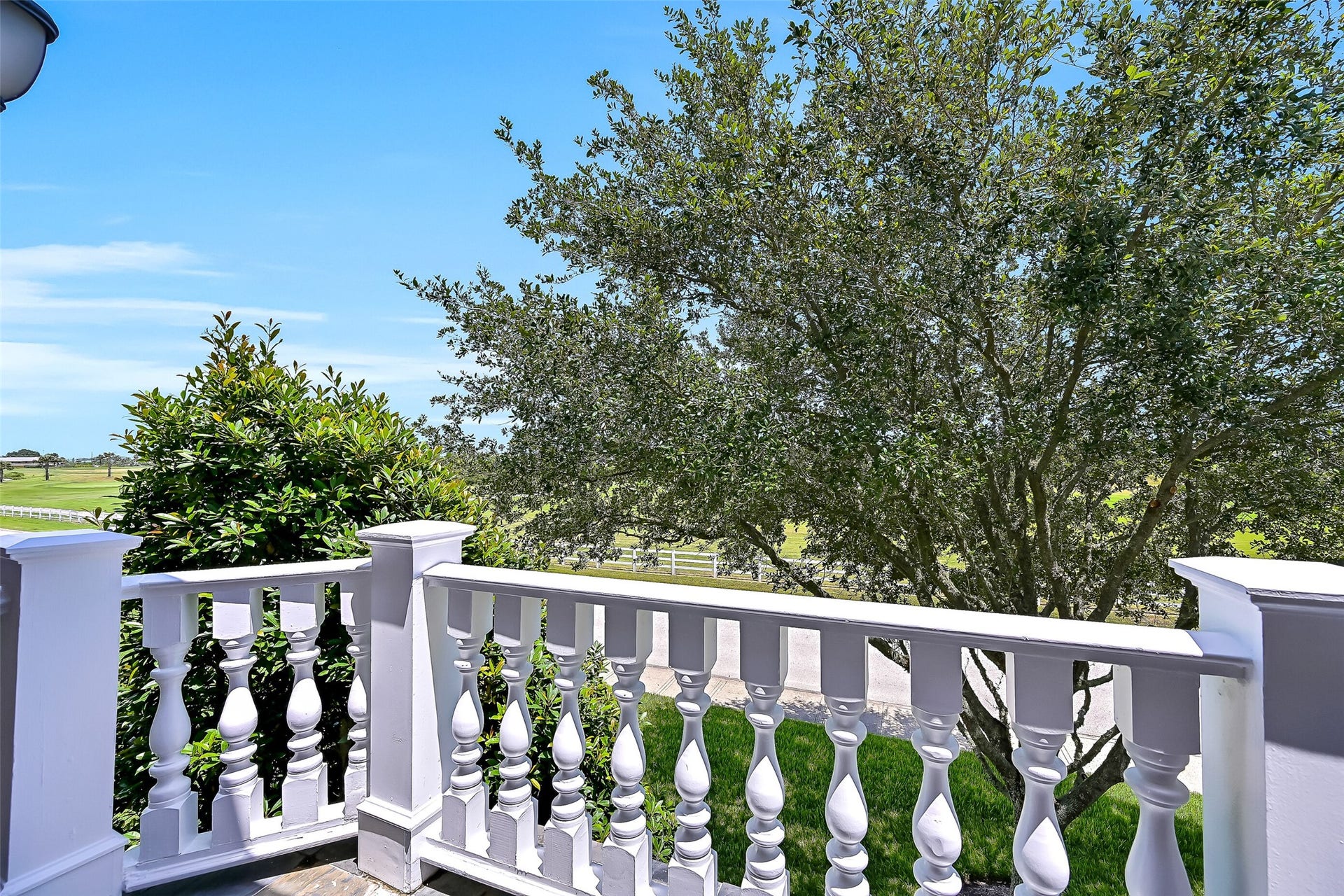 6 Barque Lane, Galveston, TX 77554 Peeks of golf course views from the private balcony from the 3rd bedroom.
