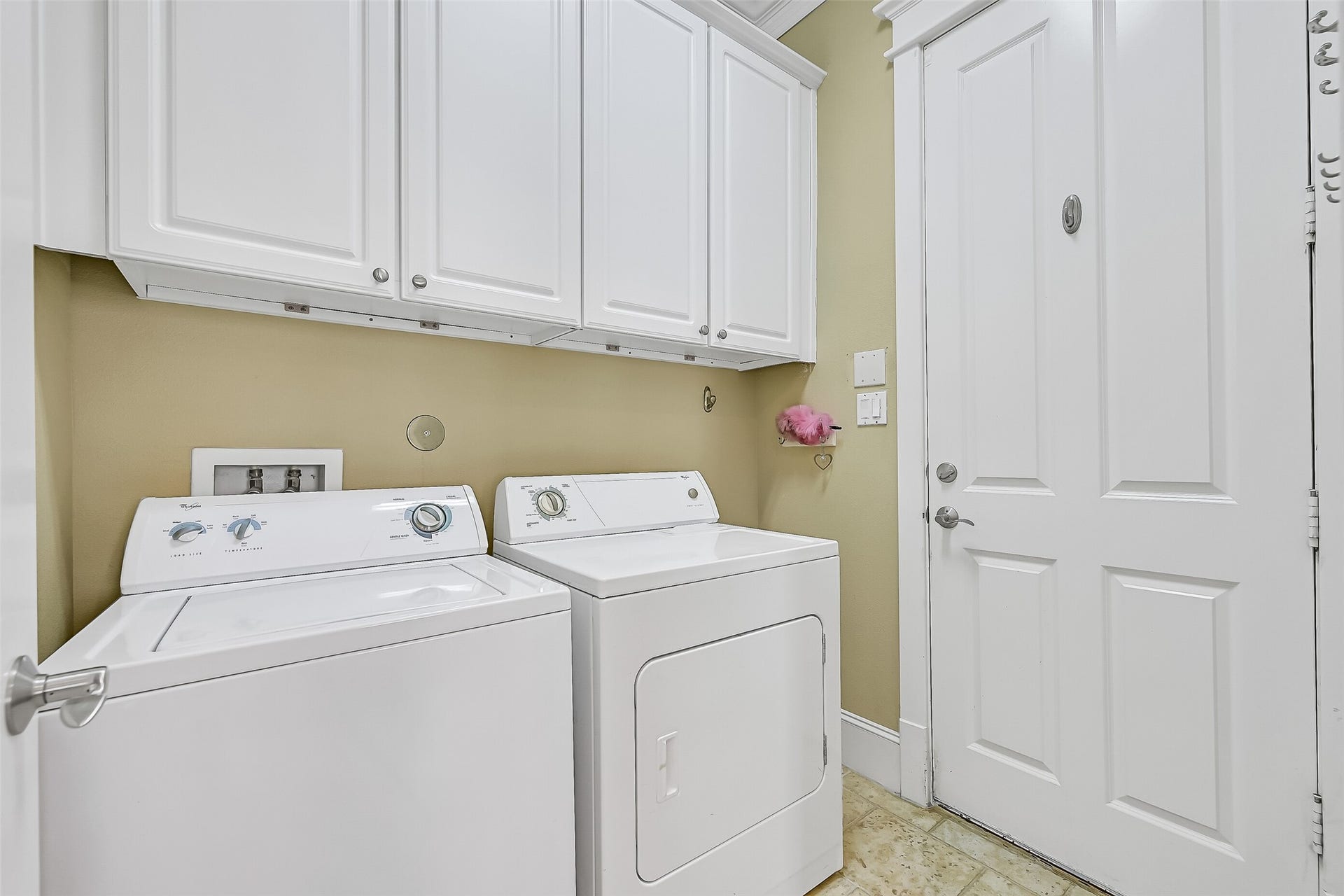 6 Barque Lane, Galveston, TX 77554 Laundry room accessed from the kitchen. The door access the 2 car garage.