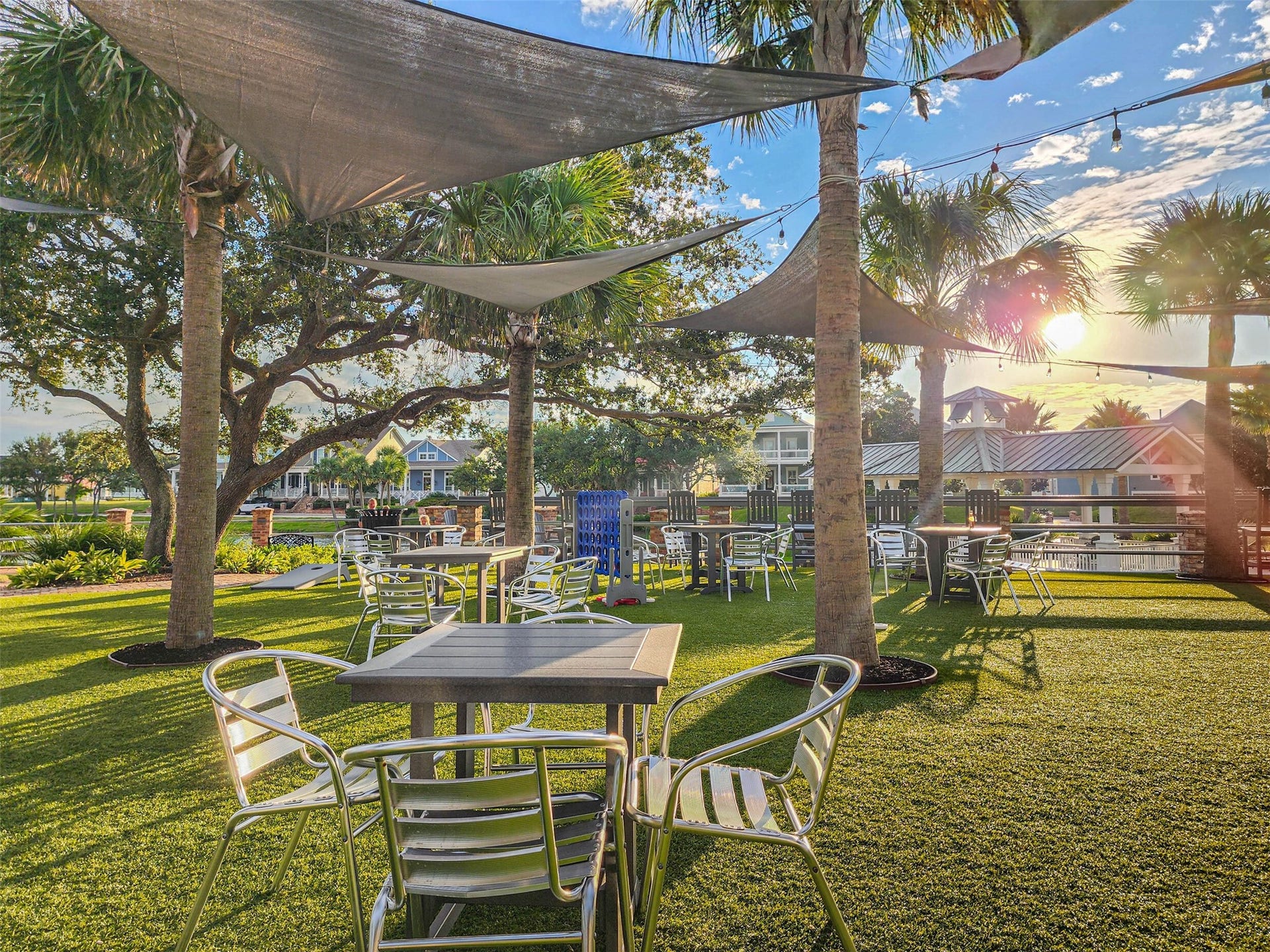 6 Barque Lane, Galveston, TX 77554 Dine al fresco with views of the meticulous landscaped grounds of Evia, with a lake view in the distance. All of this is just a short walk away!