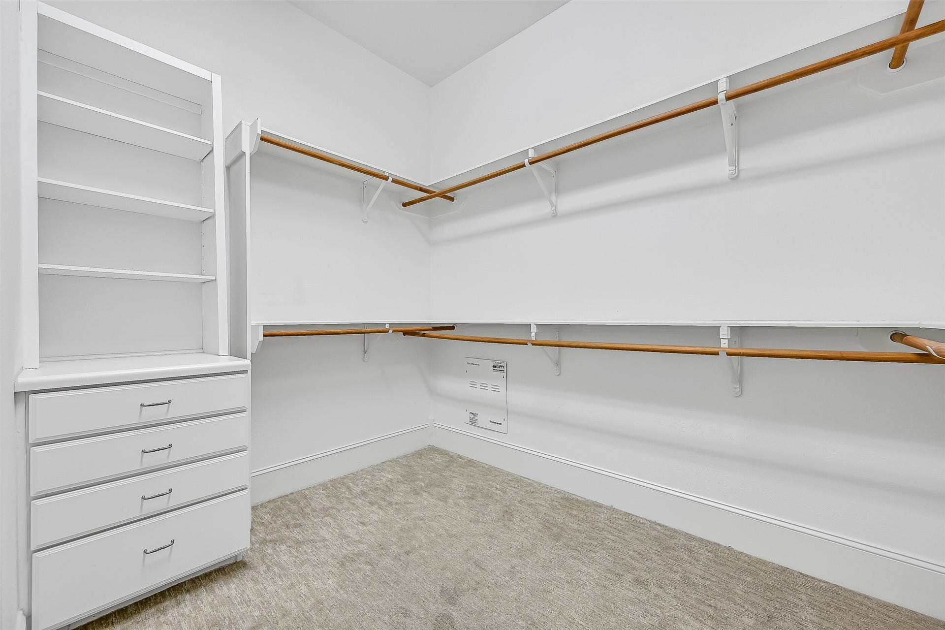 6 Barque Lane, Galveston, TX 77554 Cavernous walk-in closet featuring clever built-ins.