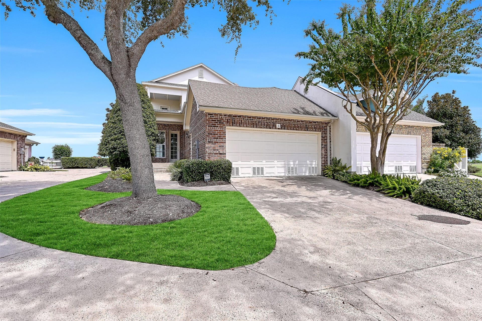 6 Barque Lane, Galveston, TX 77554 A double car driveway leads to the garage.