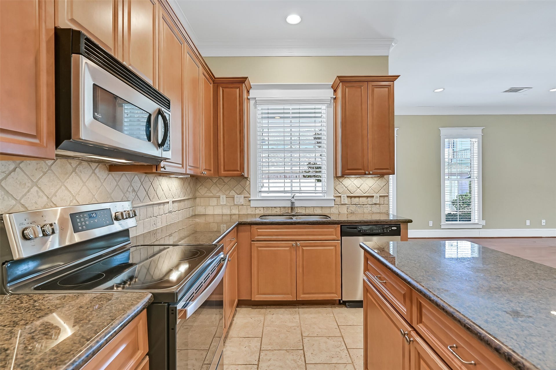 6 Barque Lane, Galveston, TX 77554 As well as the travertine backsplash. This kitchen was designed for ease of everyday living. A full suite of stainless appliances is included!