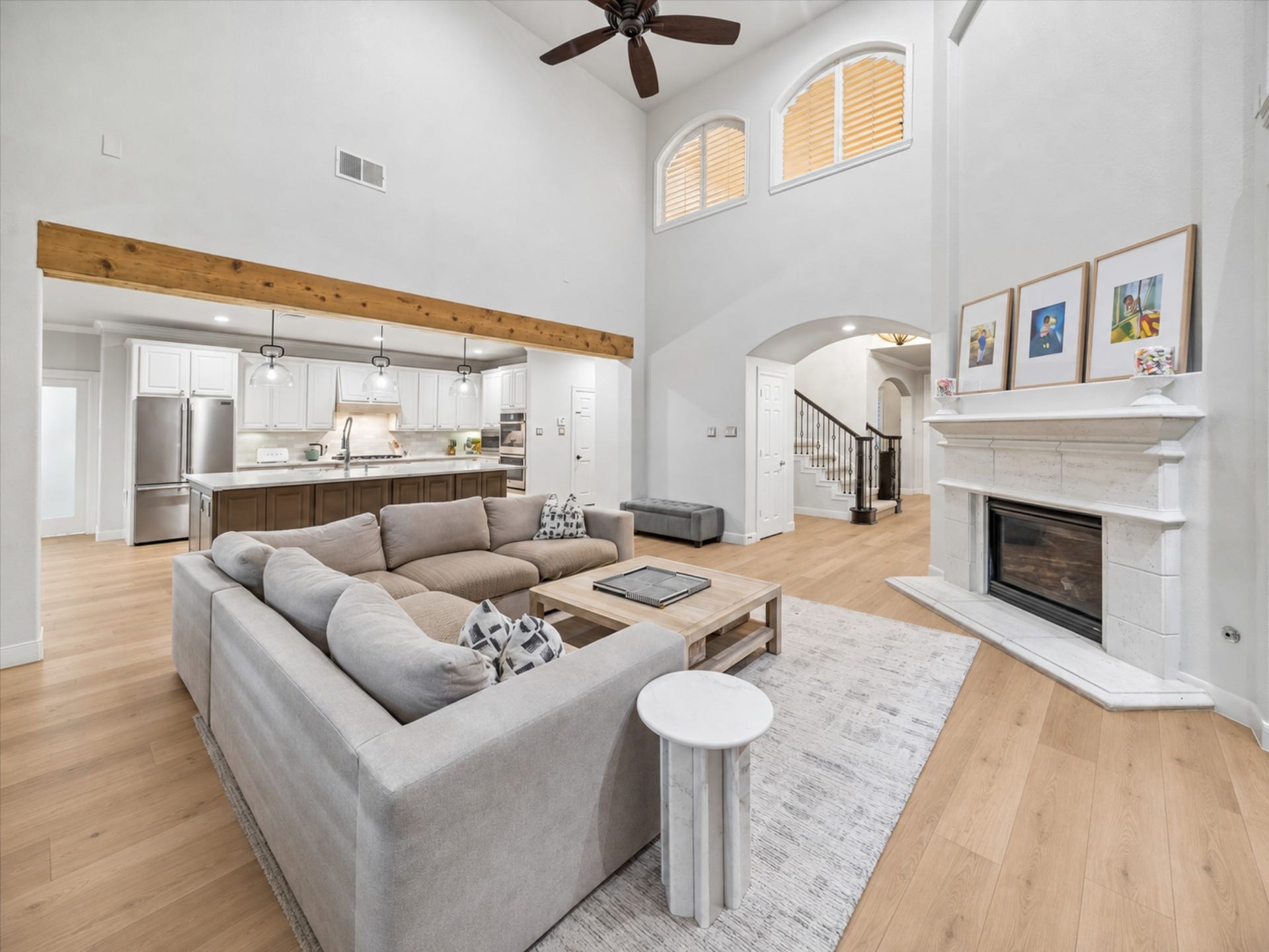 7922 EMERALD HAVEN DRIVE, Sugar Land, TX 77479 THE FAMILY ROOM CONNECTS SEAMLESSLY TO THE KITCHEN AND FEATURES HARDWOOD FLOORS, A FIREPLACE, AND IMPRESSIVE TWO-STORY CEILINGS.