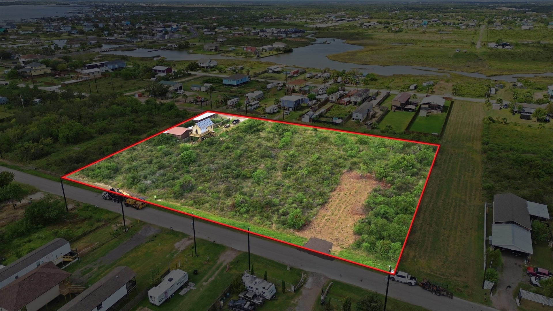 17 W Street, San Leon, TX 77539 Angled aerial with the approximate boundary outlined in red. It shows the tract's size and shape relative to the street and surrounding properties.