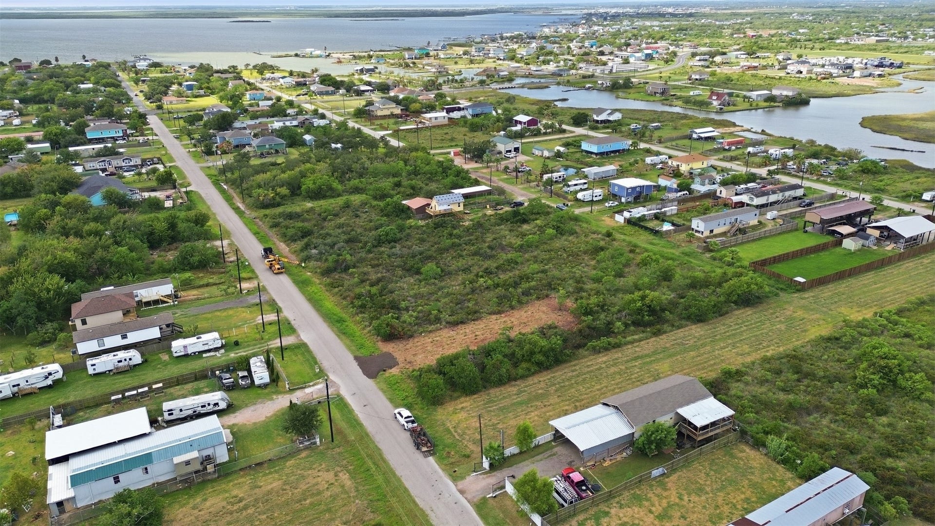 17 W Street, San Leon, TX 77539 Aerial showing the property's position in the neighborhood, with Galveston Bay and a tidal channel nearby. This view shows how close the tract is to the water.