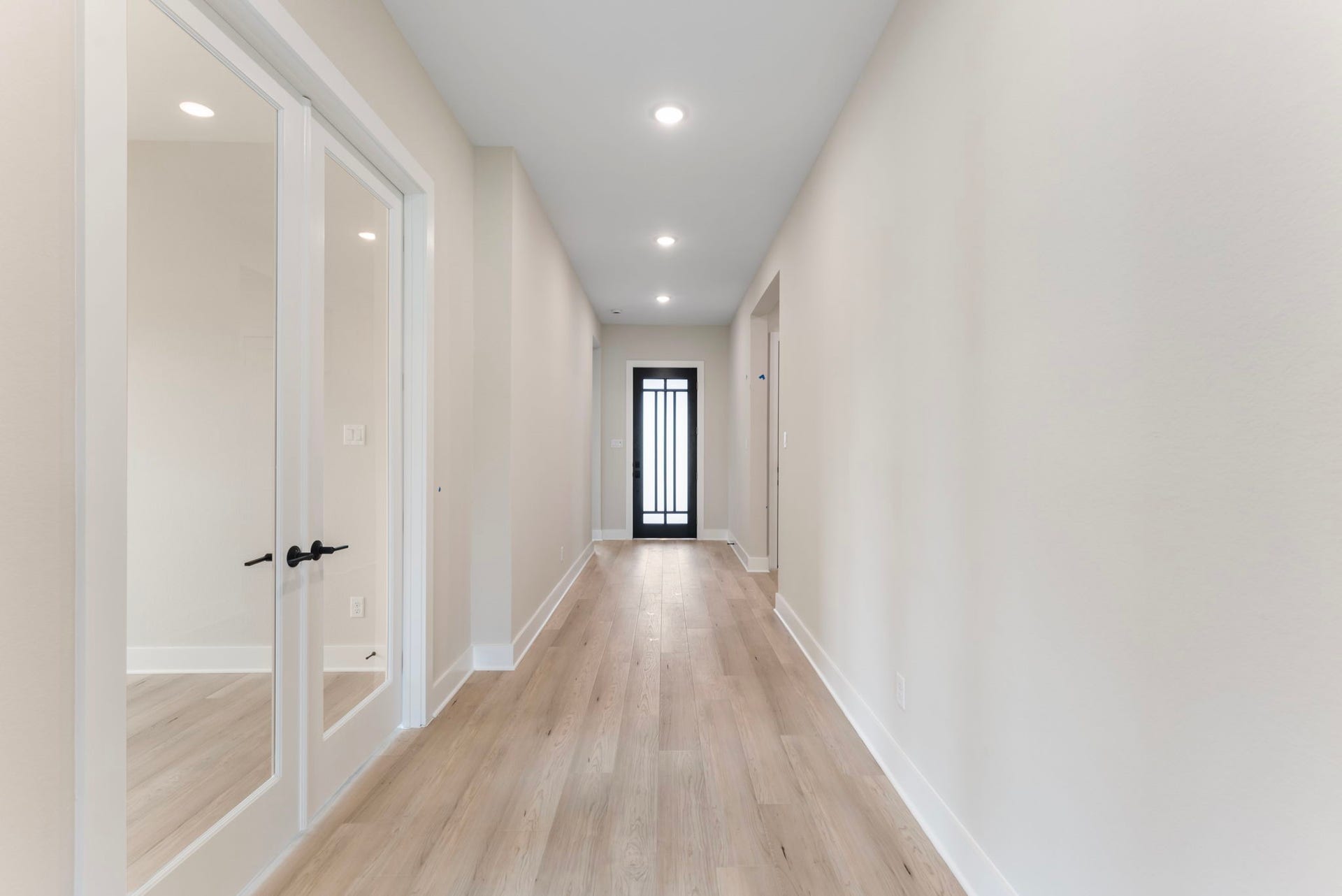 8143 Fenway Heights Dr, The Woodlands, TX 77389 Bright and Inviting hallway showing the access to the flex space