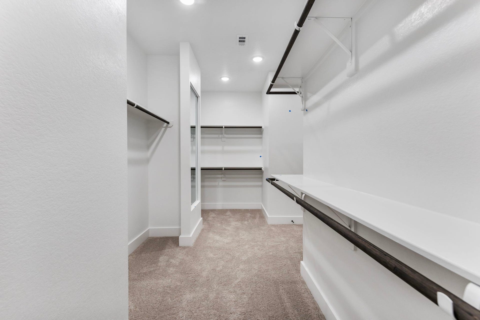 8143 Fenway Heights Dr, The Woodlands, TX 77389 Large walk-in primary bedroom with plenty of storage that connects with the laundry area, for added convenience.